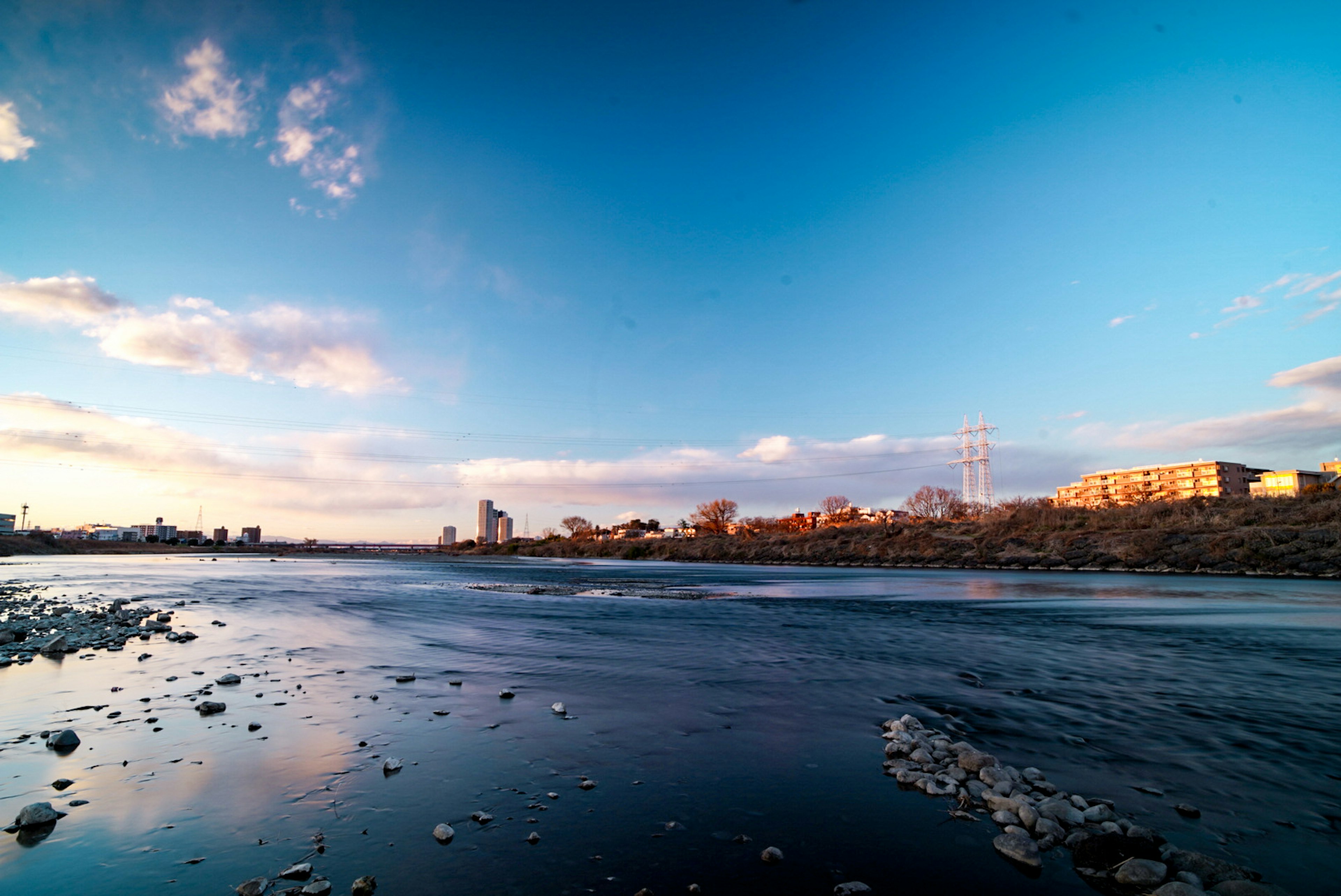 Beautiful landscape featuring a river and expansive blue sky