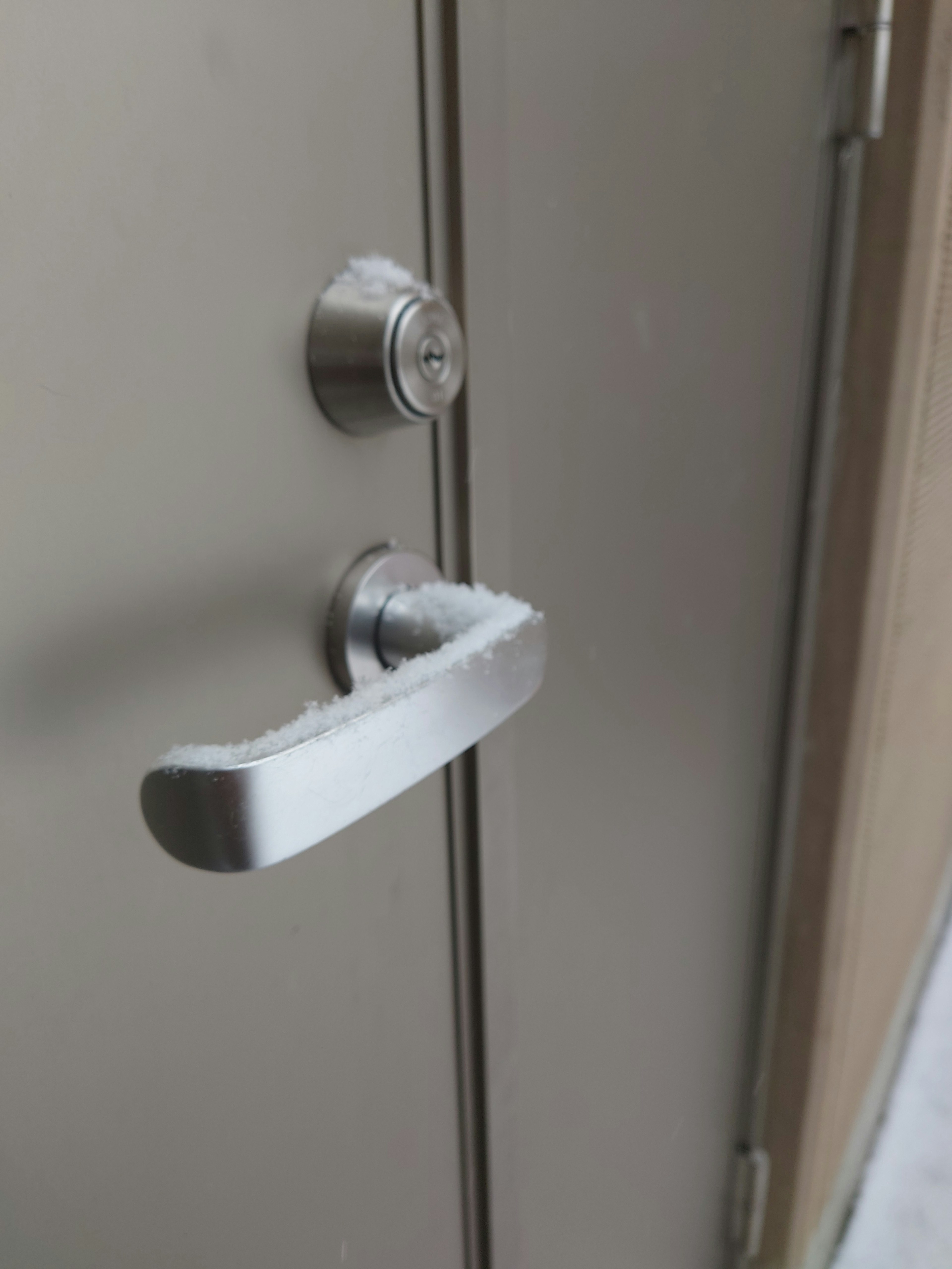 Close-up photo of a door handle and keyhole