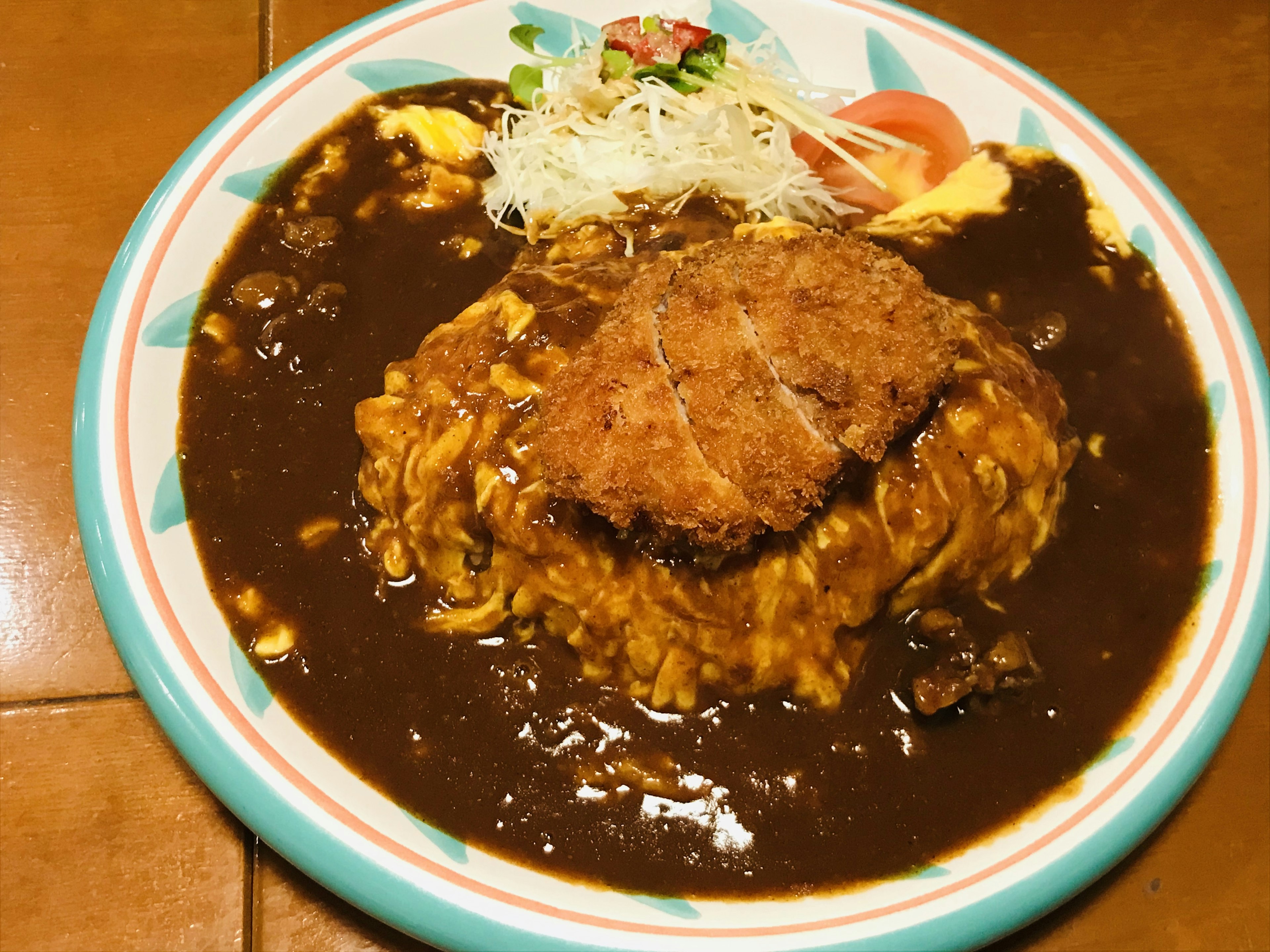 Katsu curry omelette rice served with salad