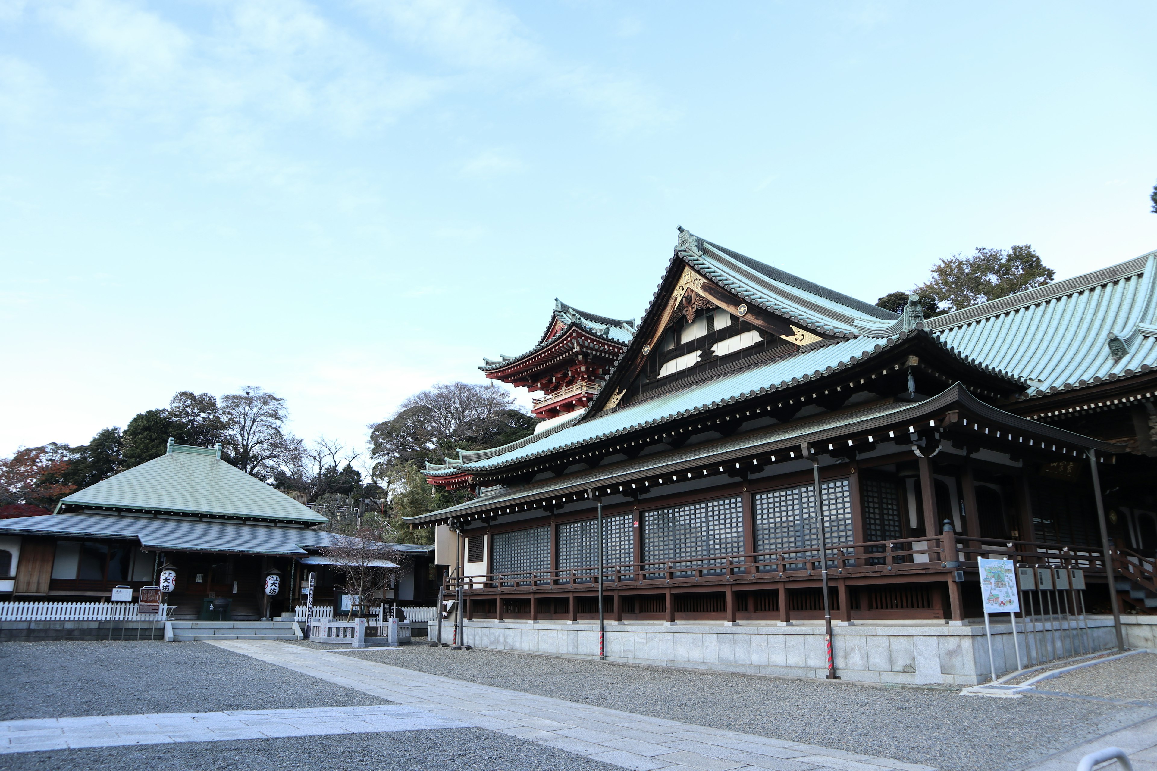 Traditional Japanese shrine building with a blue sky