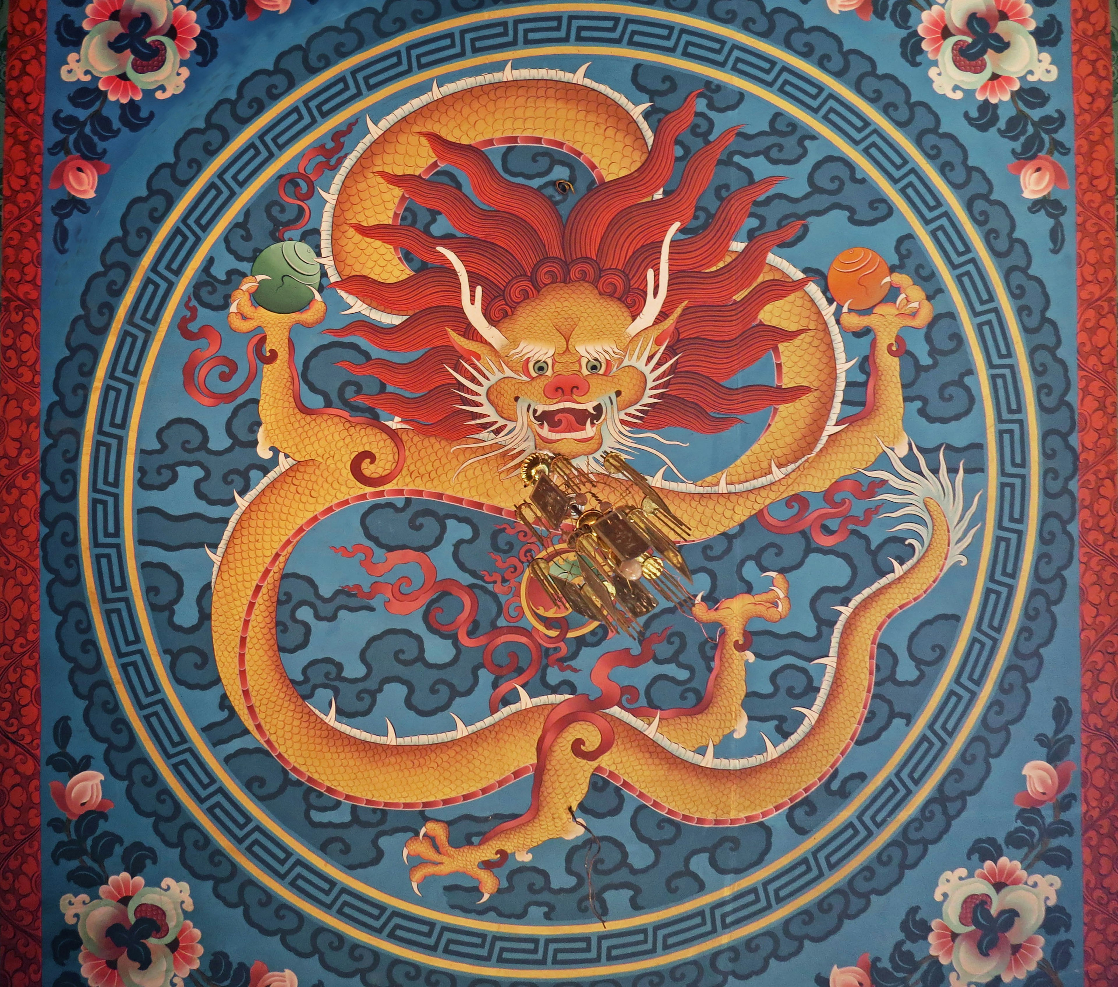 A vibrant dragon with red hair depicted against a blue background