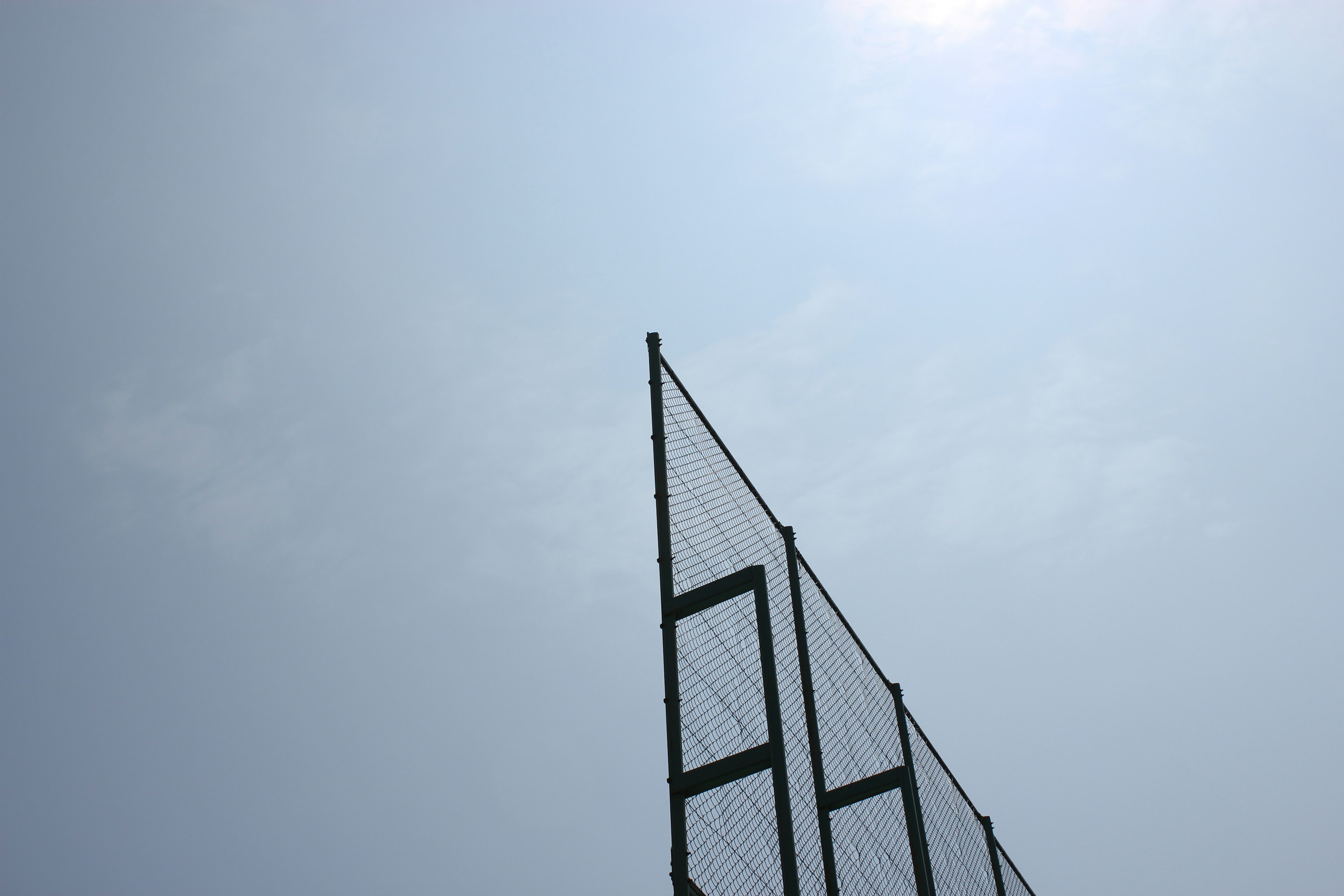 Part of a net against a blue sky