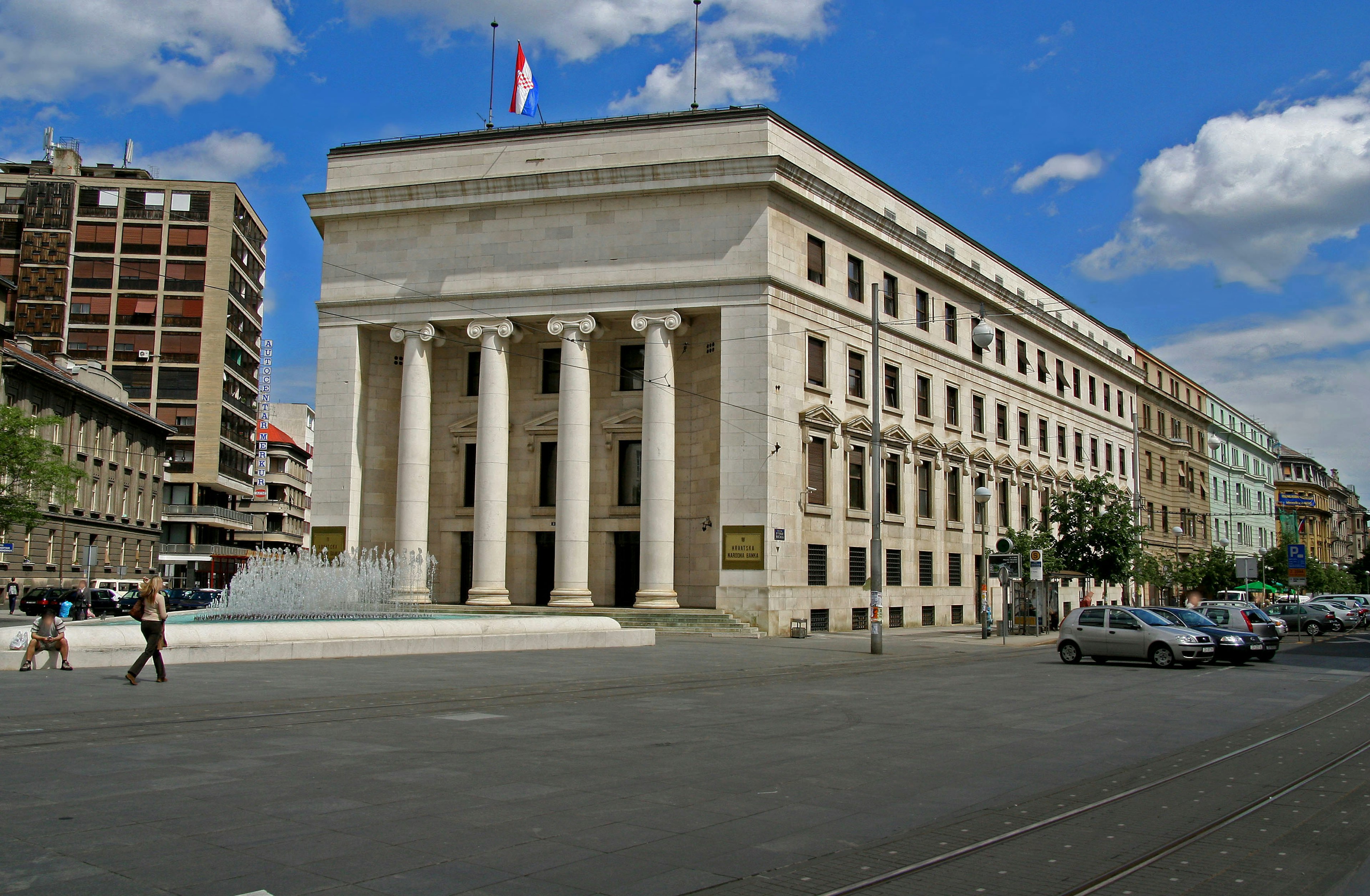 Large columned building with a blue sky backdrop