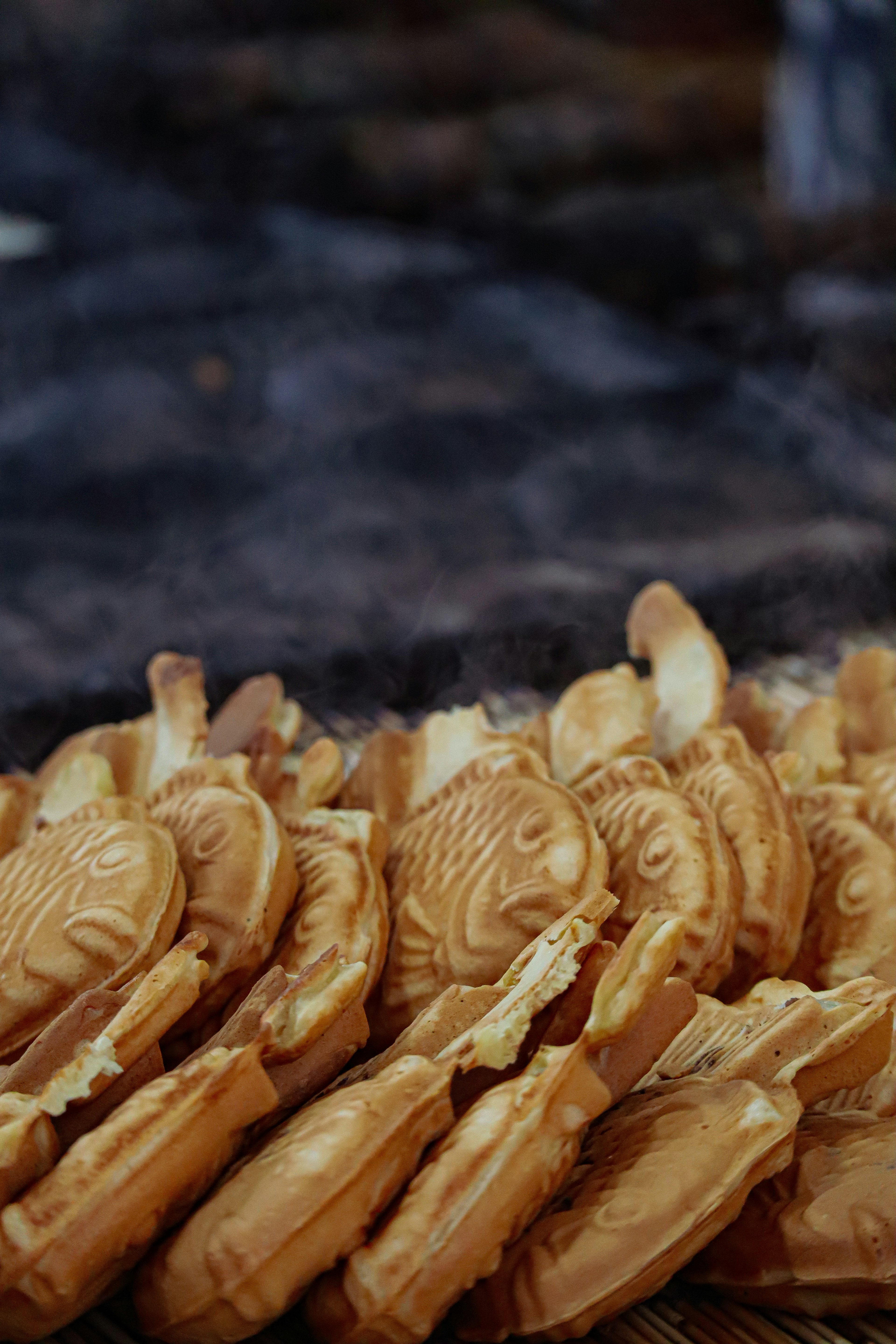 Fish-shaped baked goods arranged in a stack