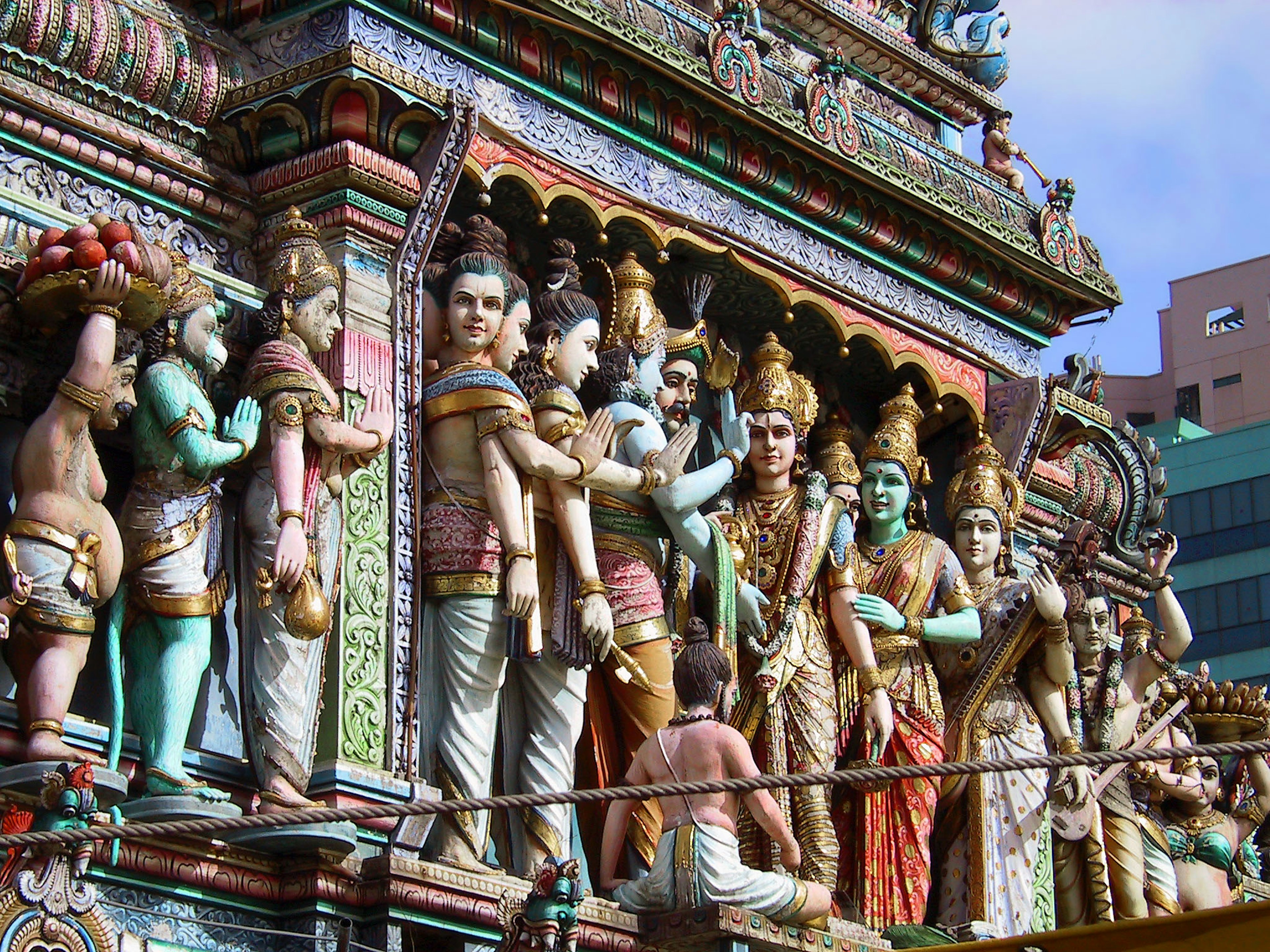 Colorful Hindu deities sculptures adorning the temple facade