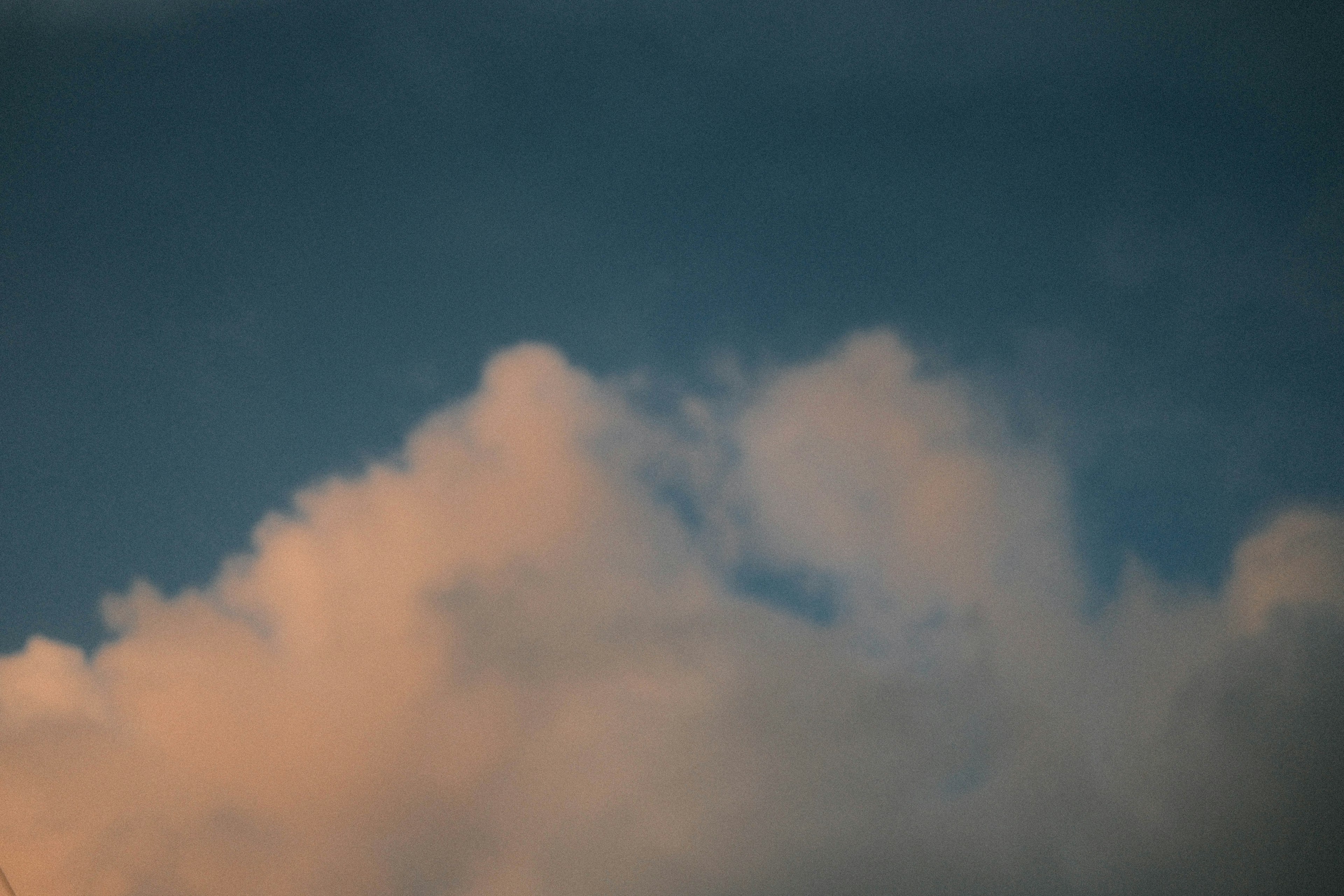 Puffy clouds against a blue sky