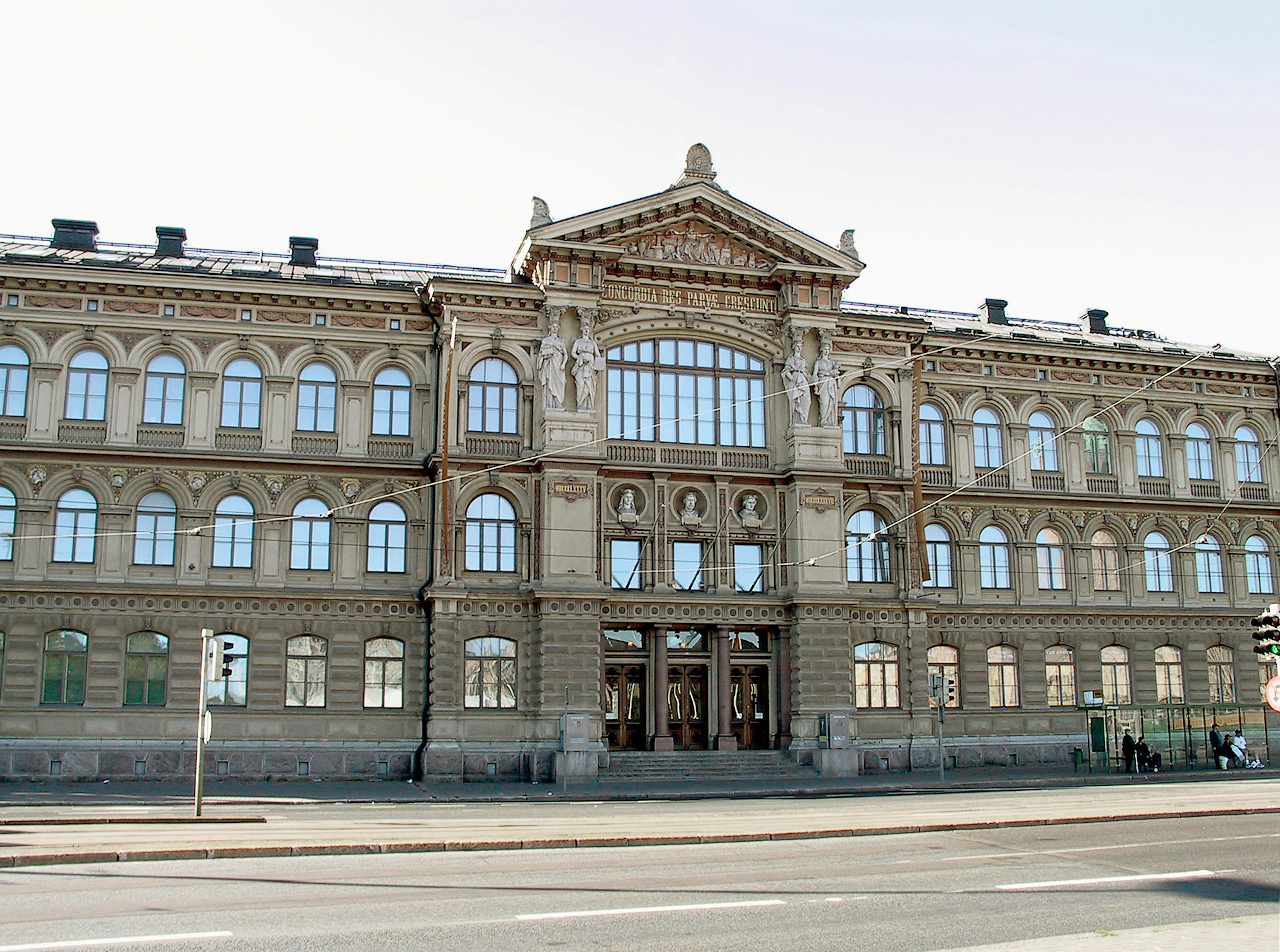 Facade of a historic building with large windows and beautiful architectural details