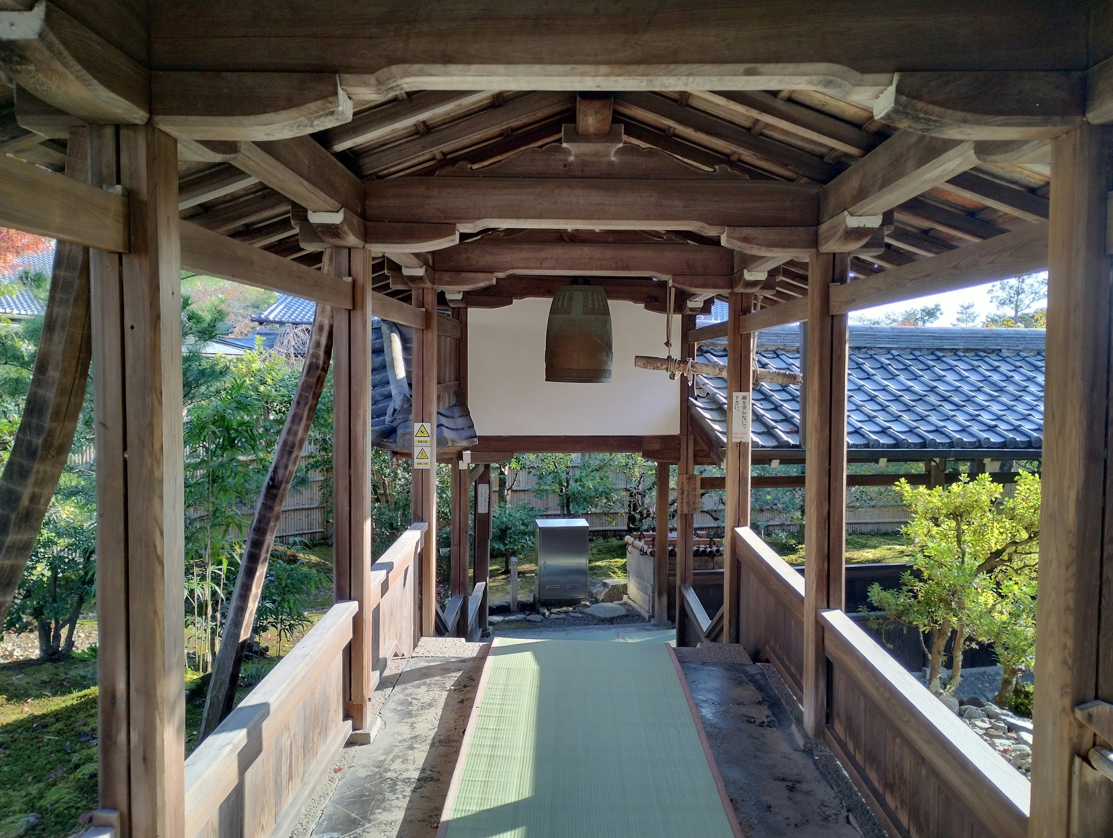 Wooden bridge-like structure in a garden pathway