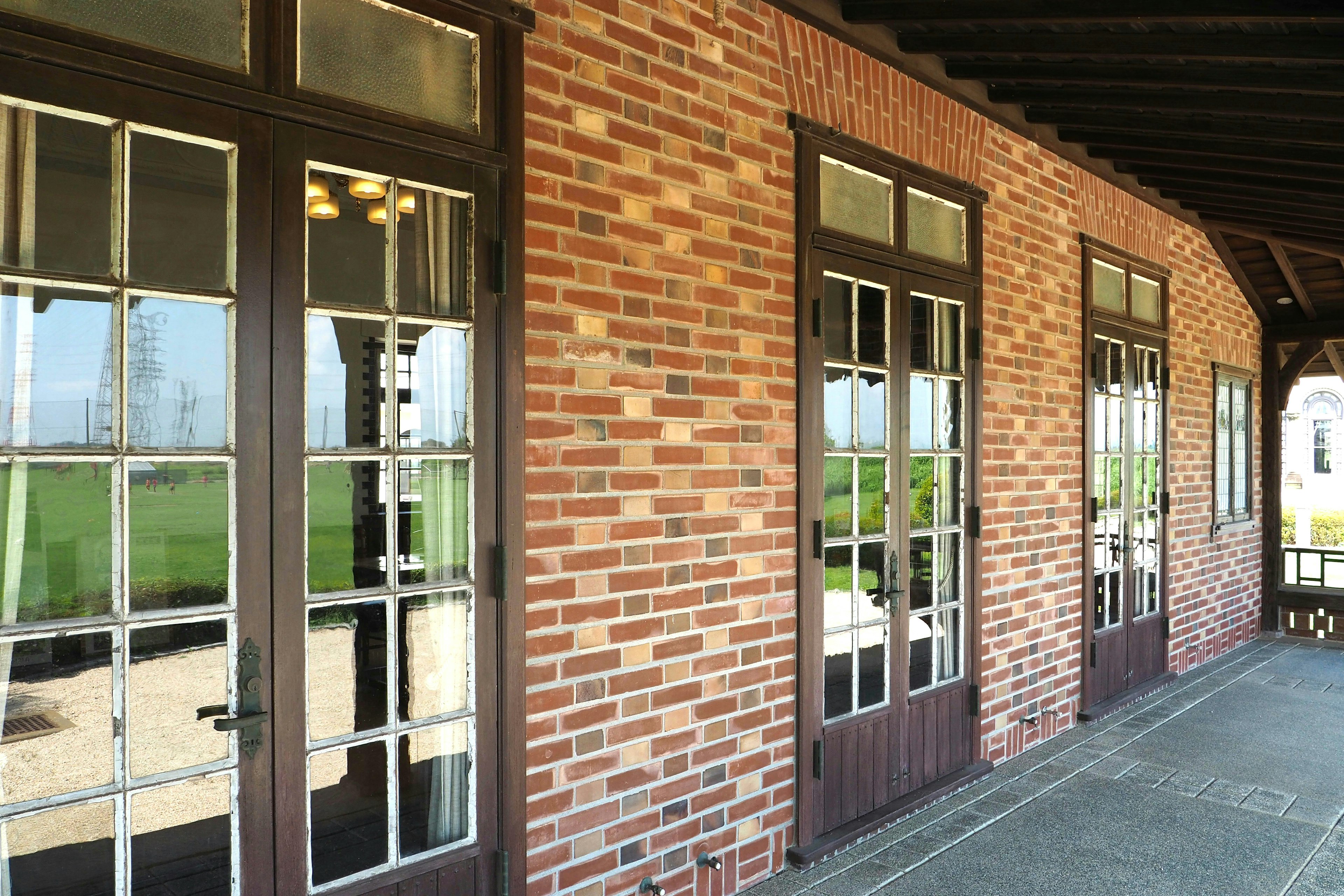 Exterior view of a brick building with large windows