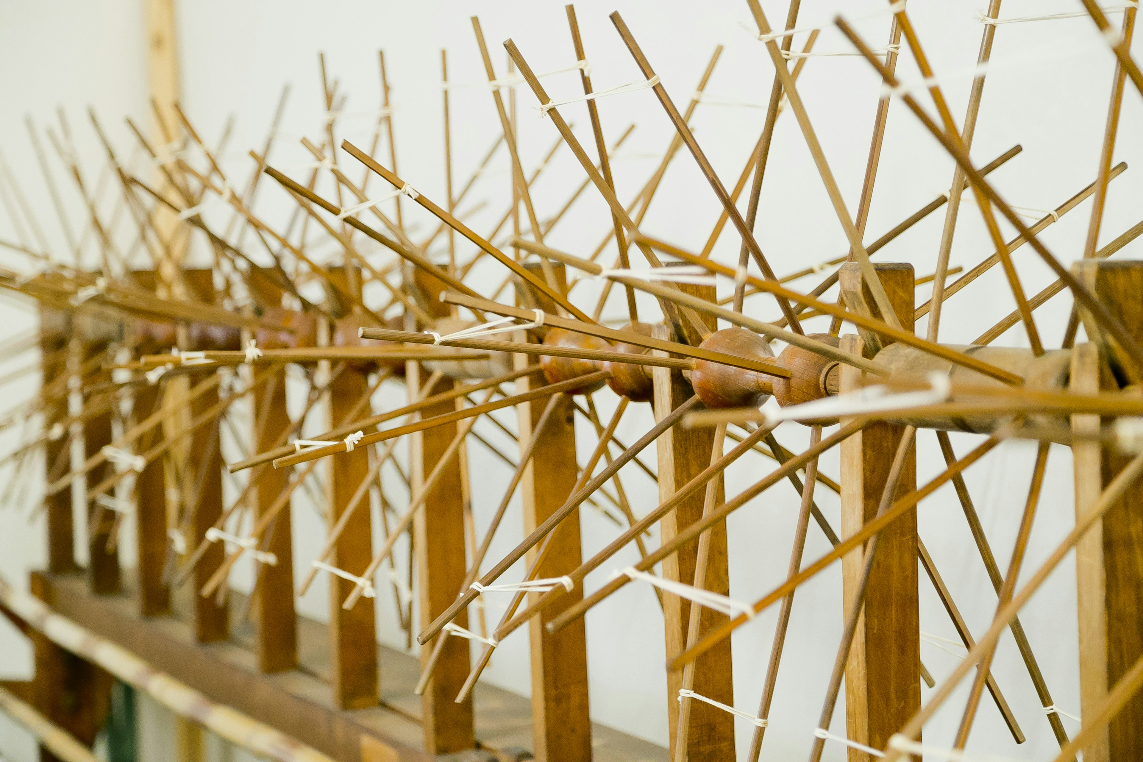 Detailed wooden structure with arranged bamboo sticks