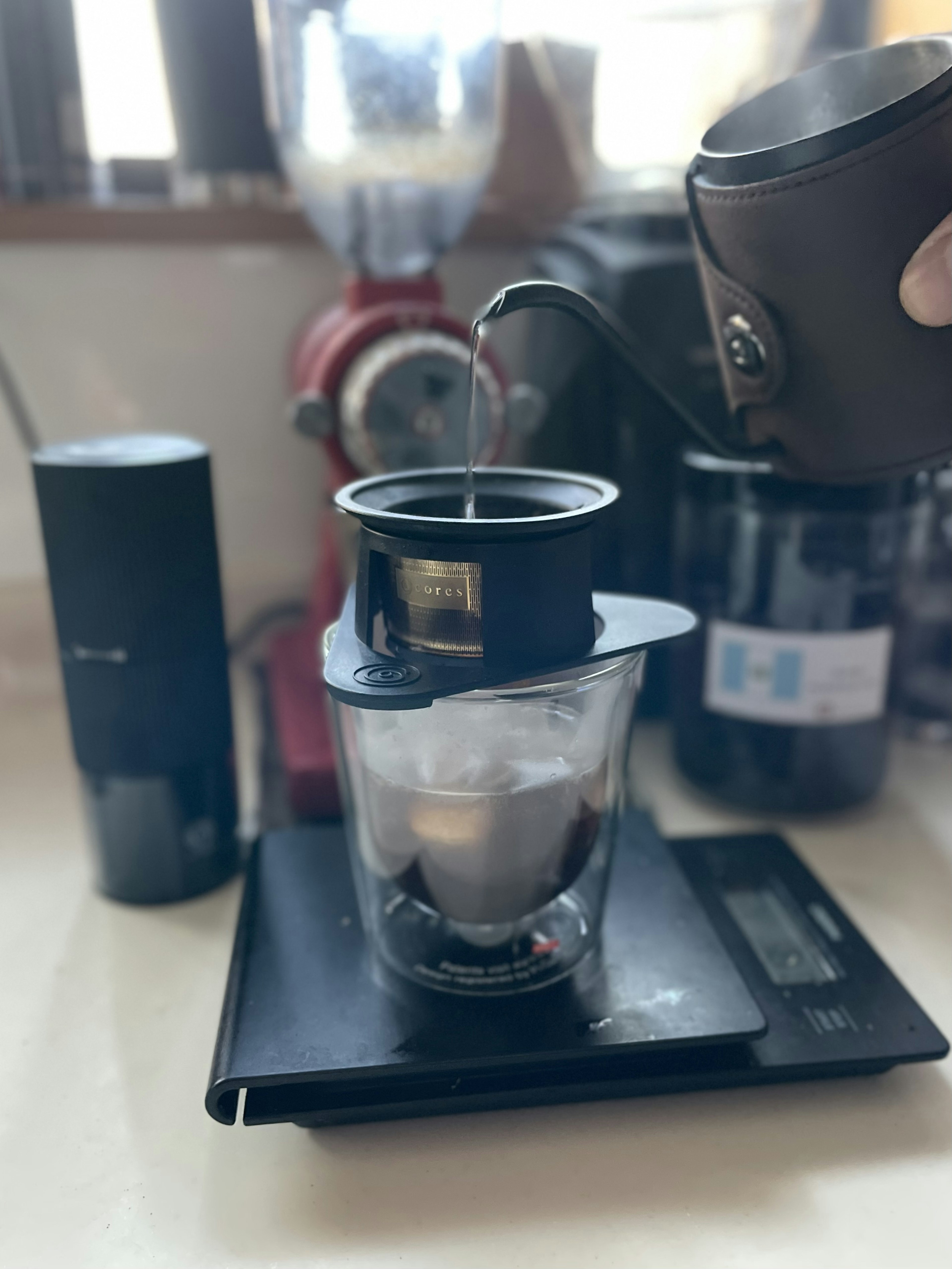 Brewing coffee with a scale and cup visible