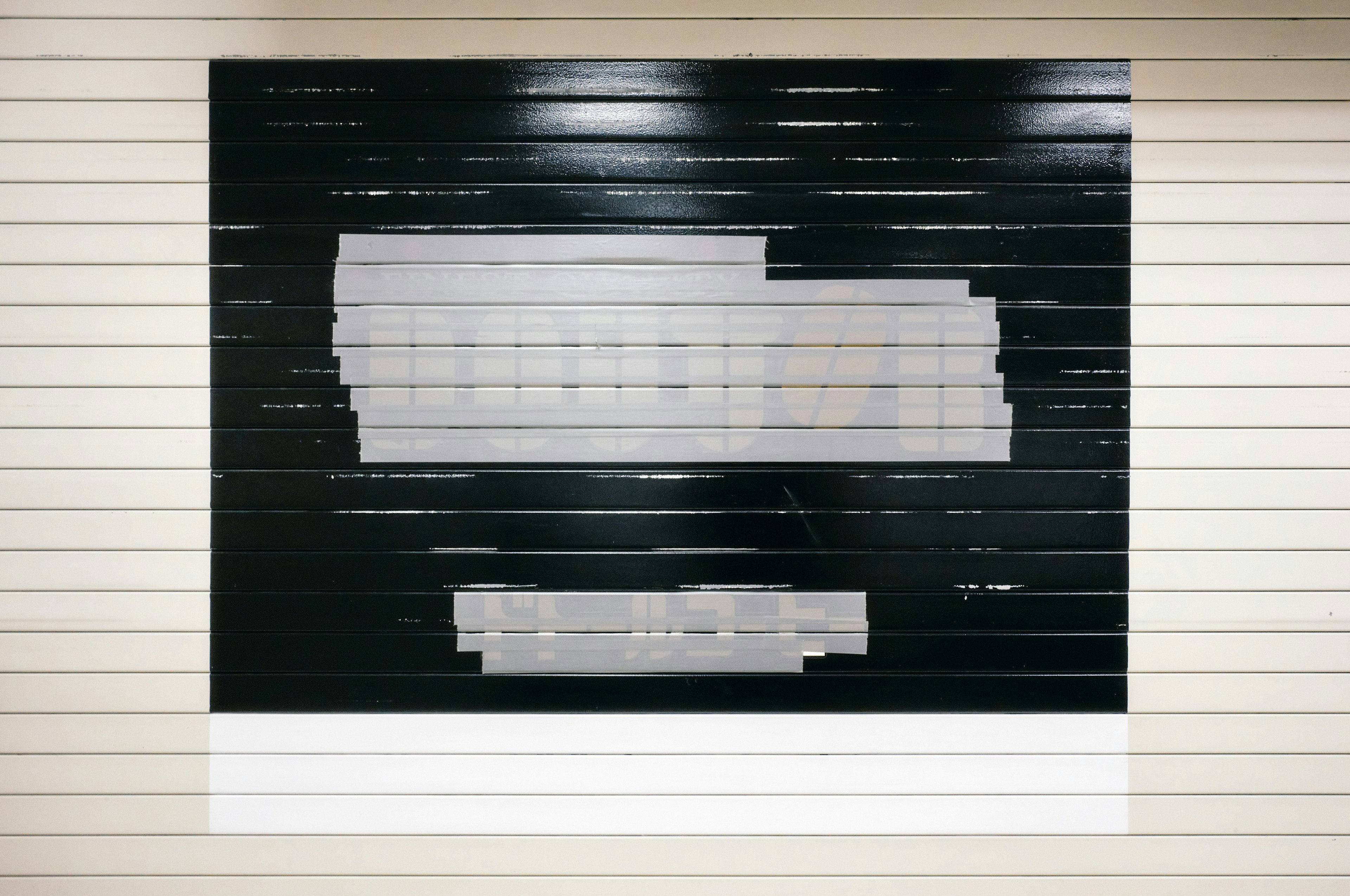 An artwork with white stripes on a black background