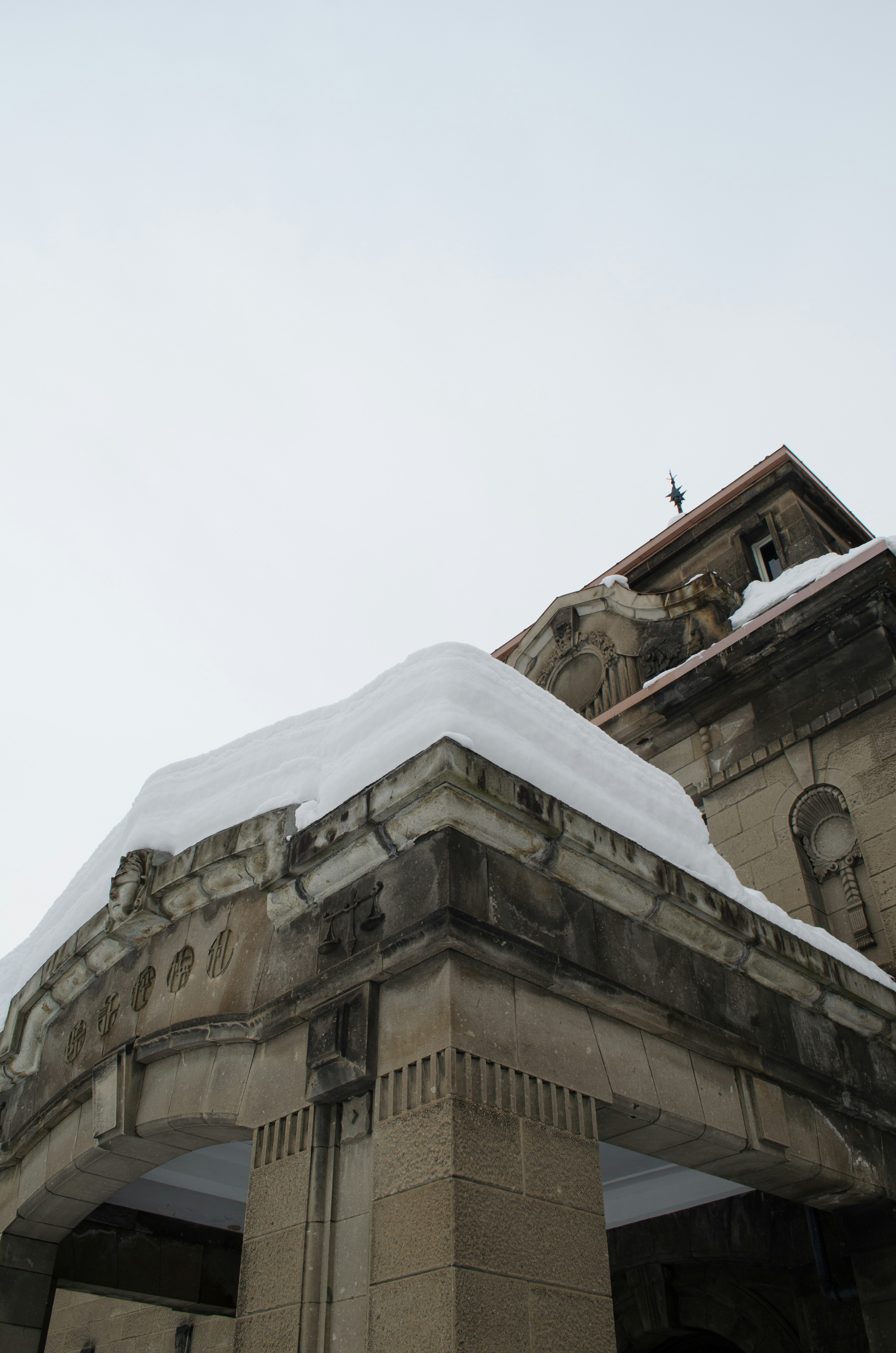 Part of a historic building covered in snow