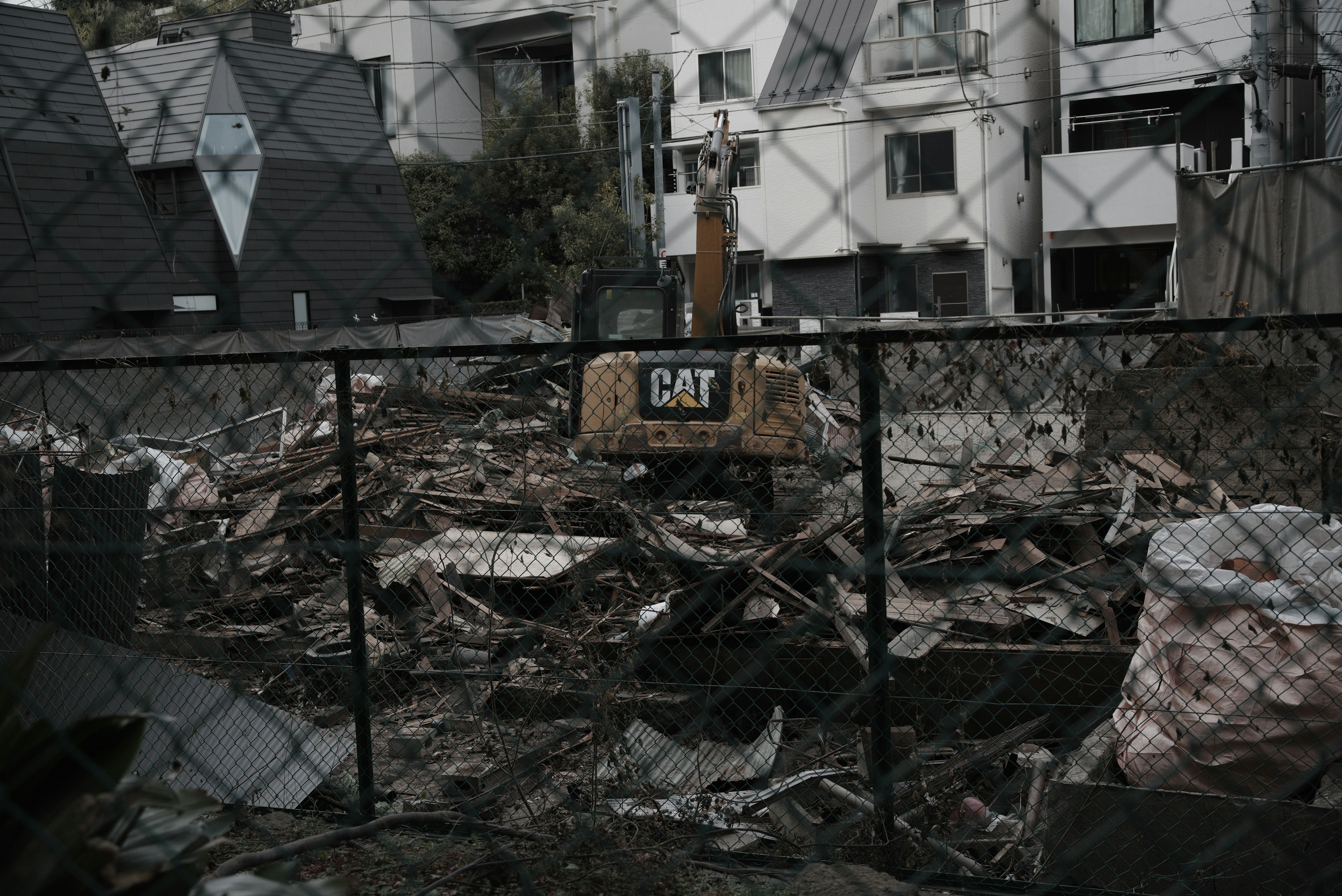 Construction site with heavy machinery and scattered debris