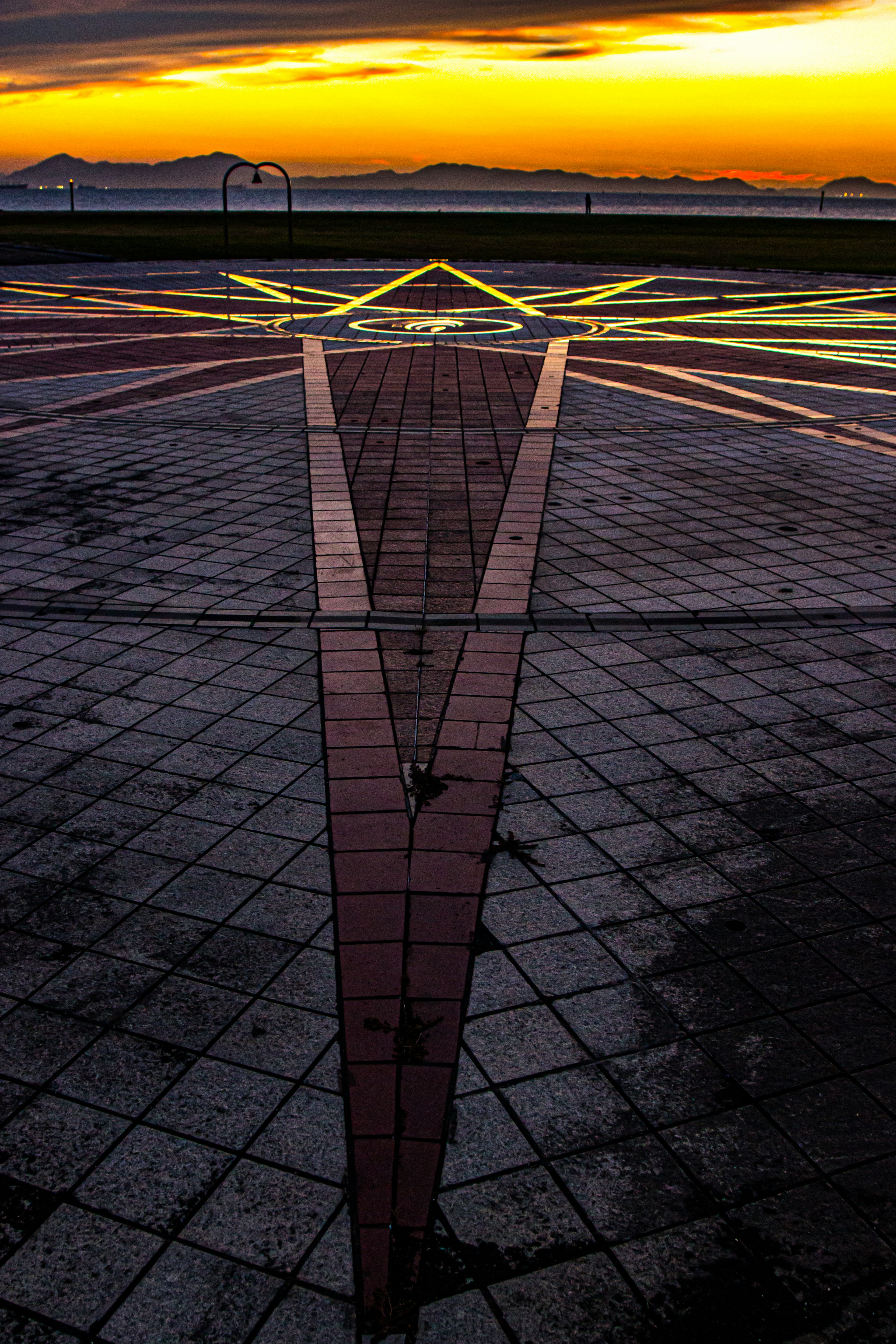 Geometric pavement design with sunset backdrop