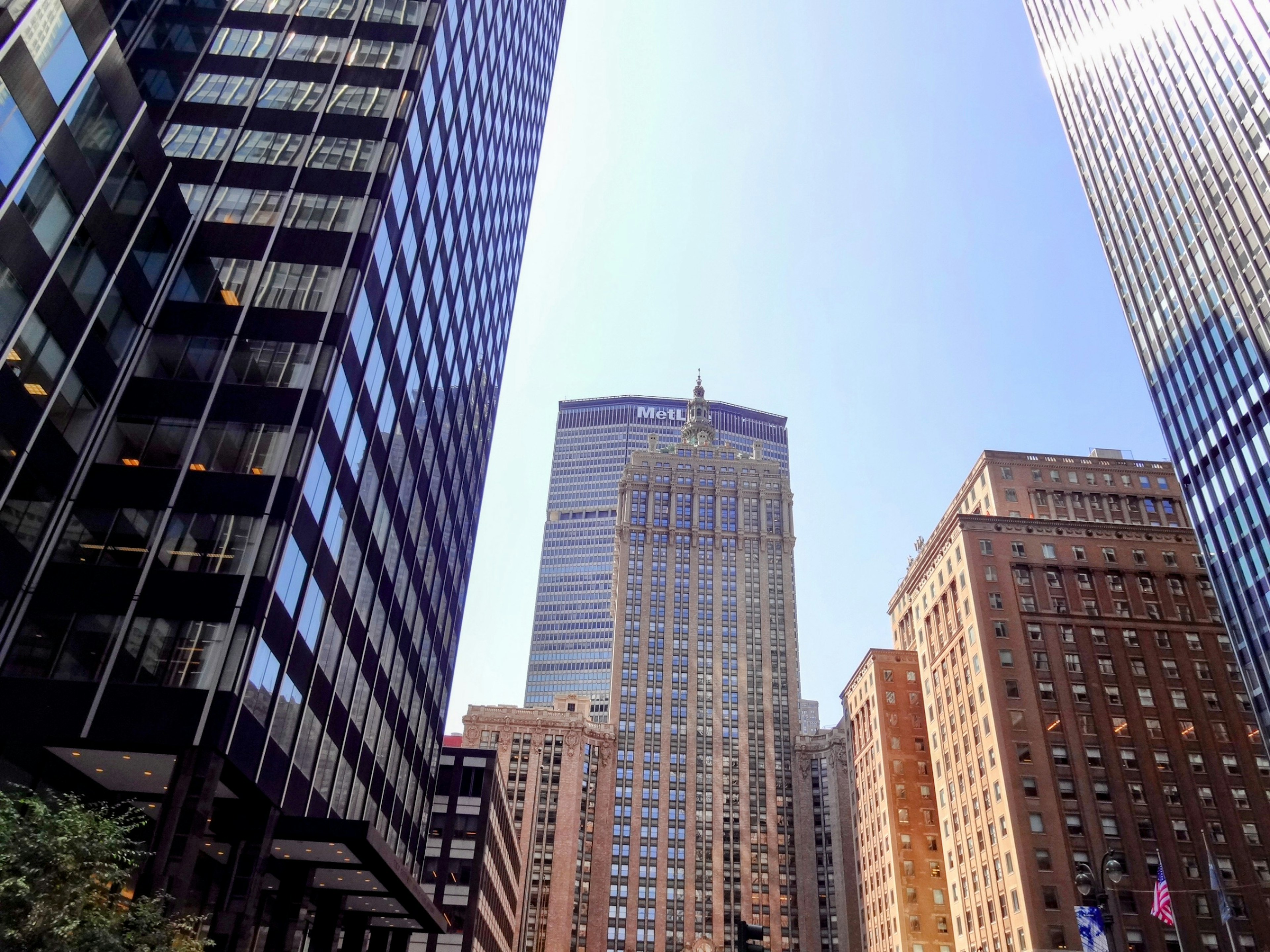 Urban landscape featuring tall skyscrapers and clear blue sky