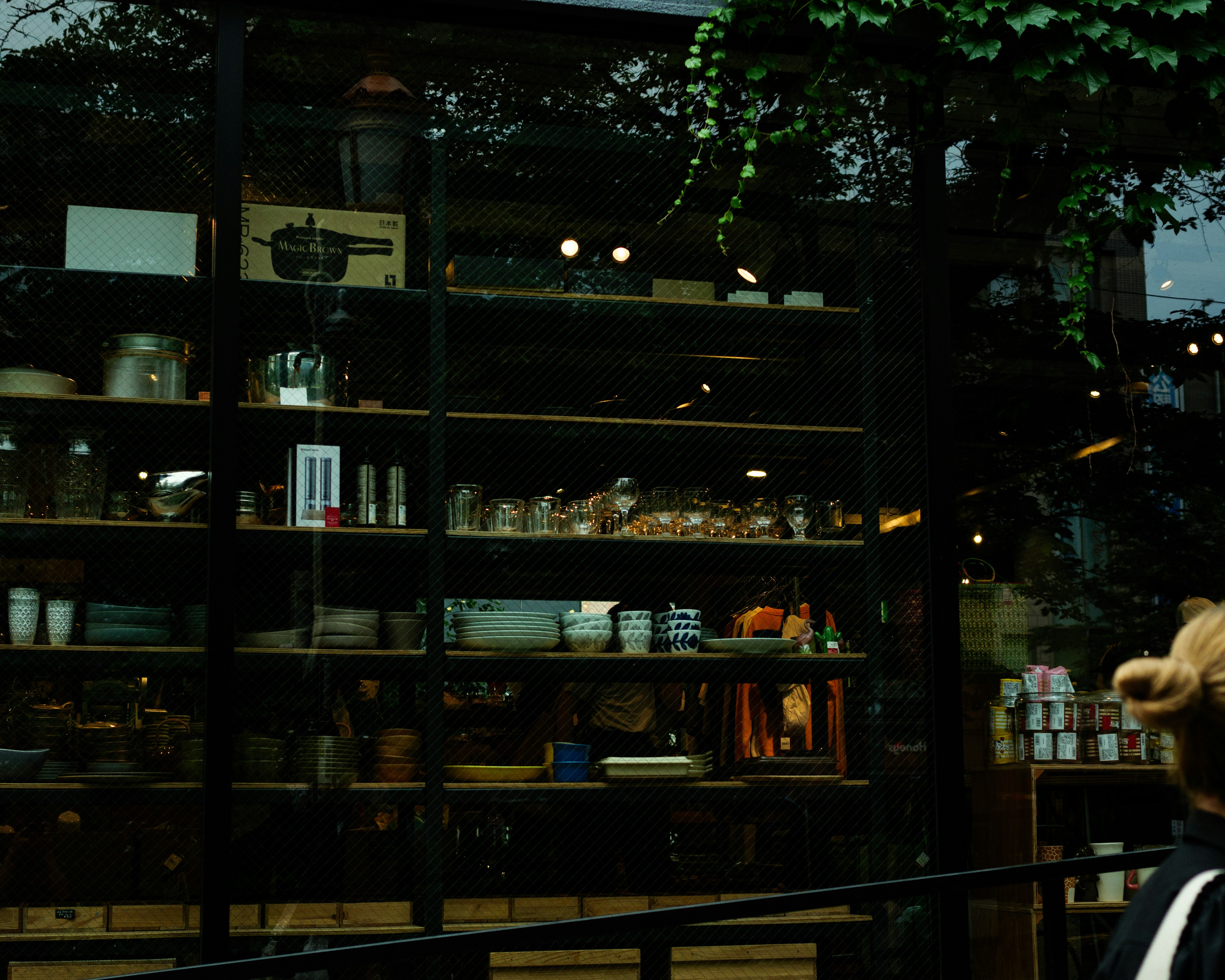 Display of dishes and kitchenware in a glass storefront