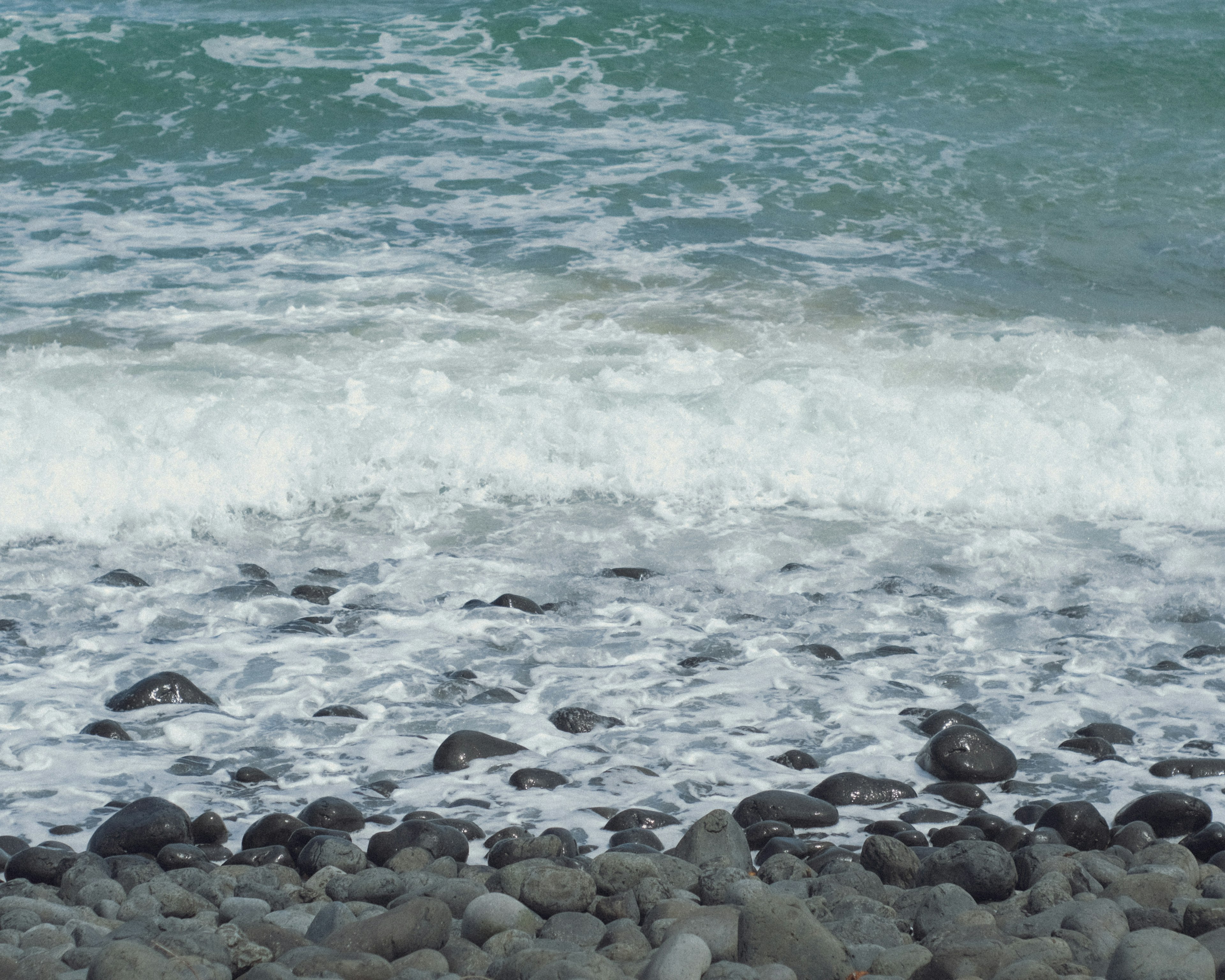 Rocky shoreline with waves crashing