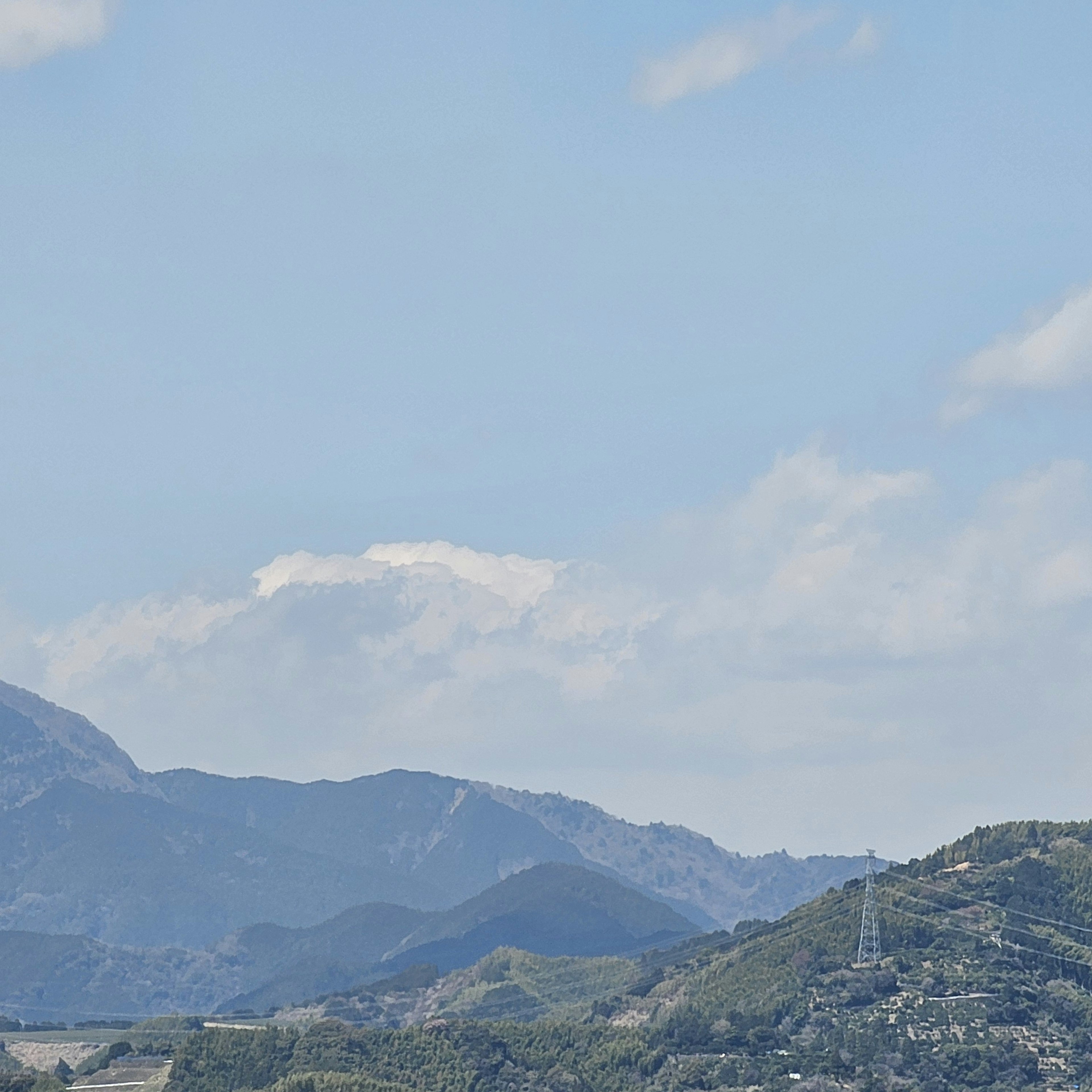 Landscape featuring mountains under a blue sky