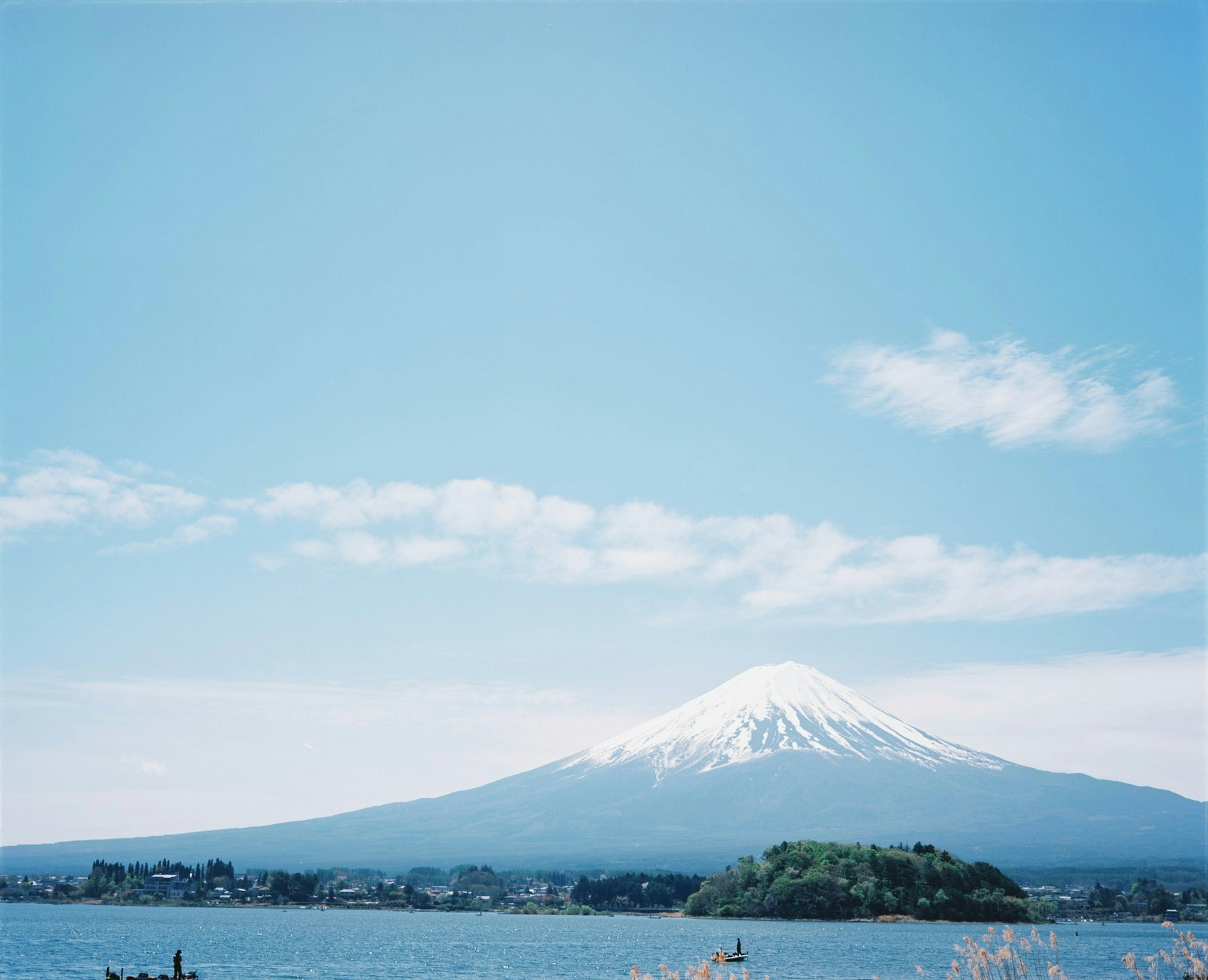 Snow-capped Mount Fuji against a clear blue sky