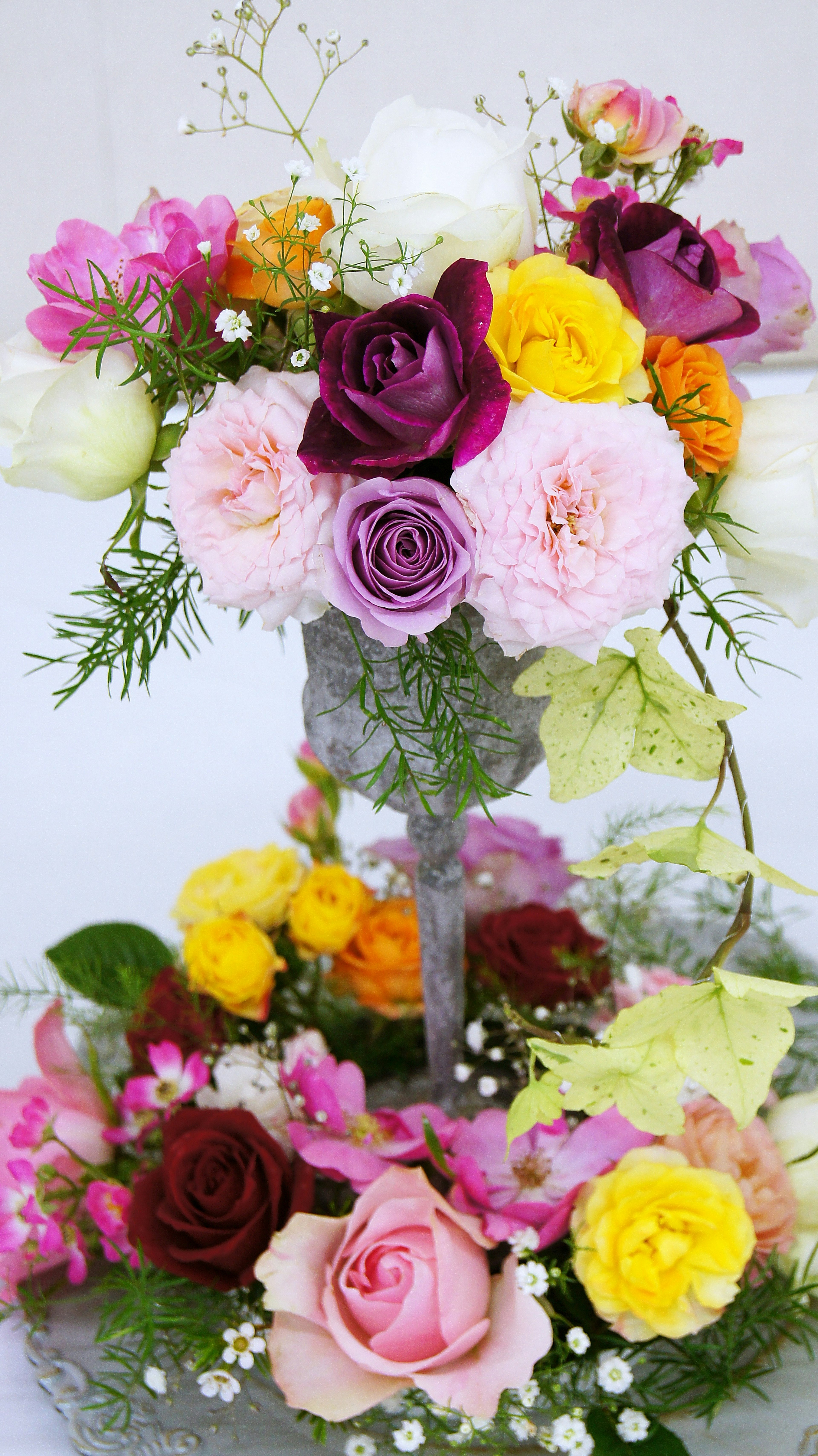 Beautiful floral arrangement with colorful roses and other flowers in an elegant design