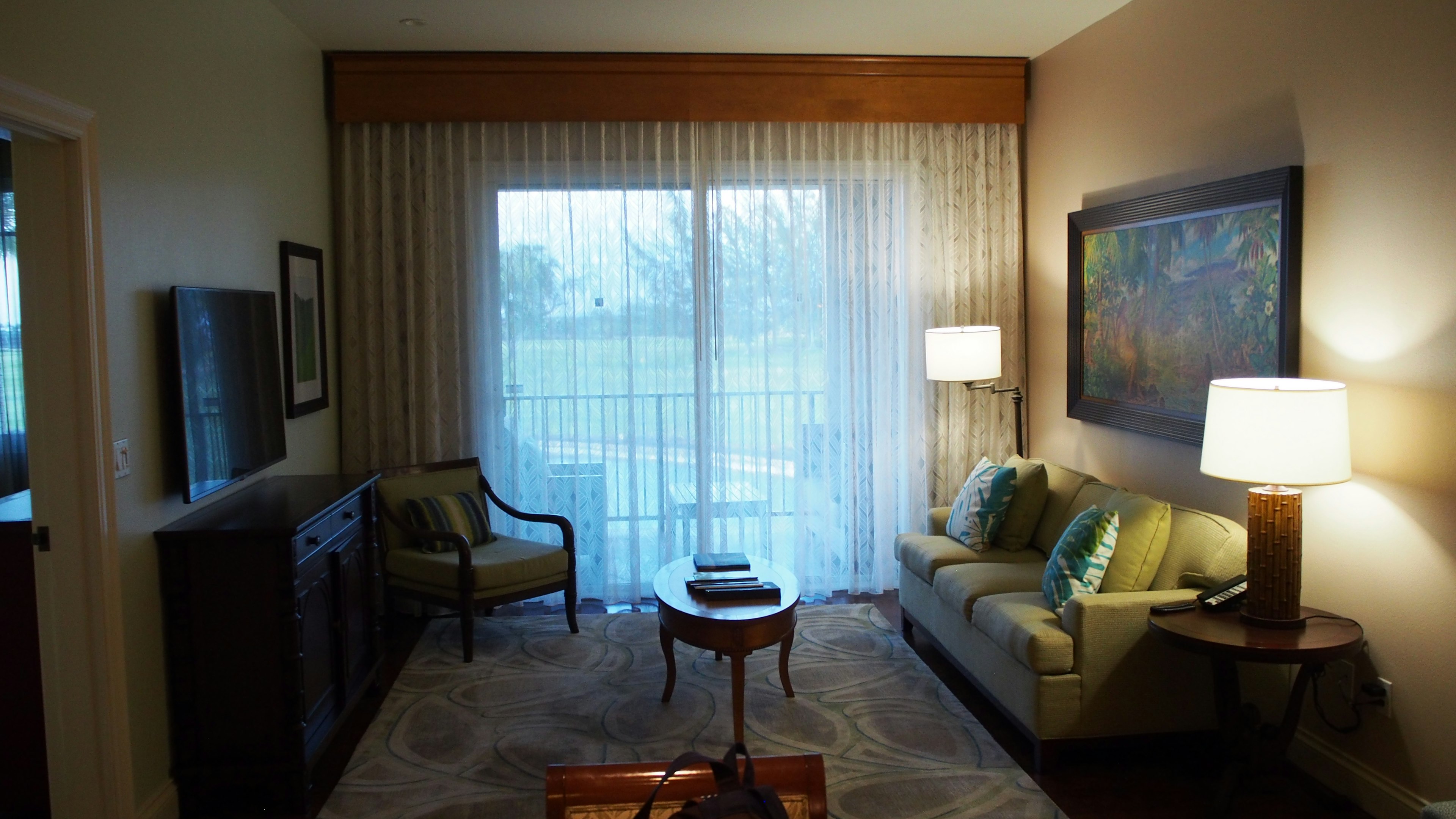 Bright living room interior featuring a sofa, coffee table, and natural light from the window