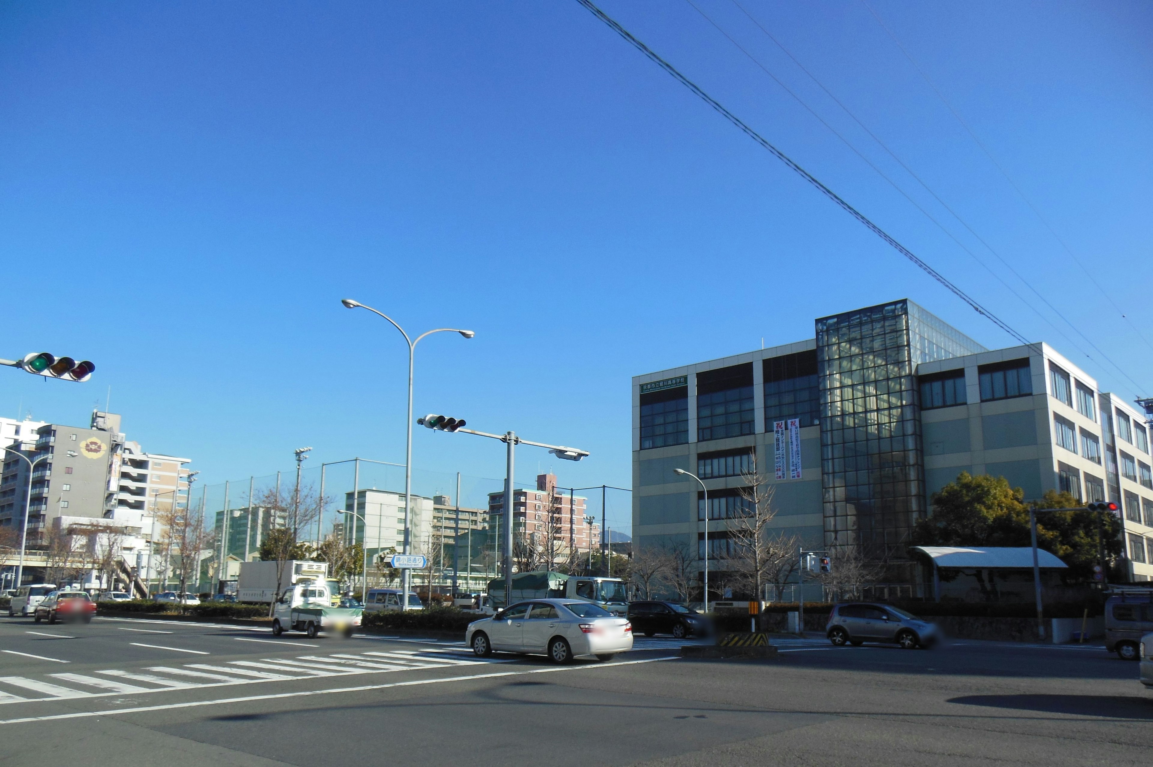 Modern building and intersection under a clear blue sky