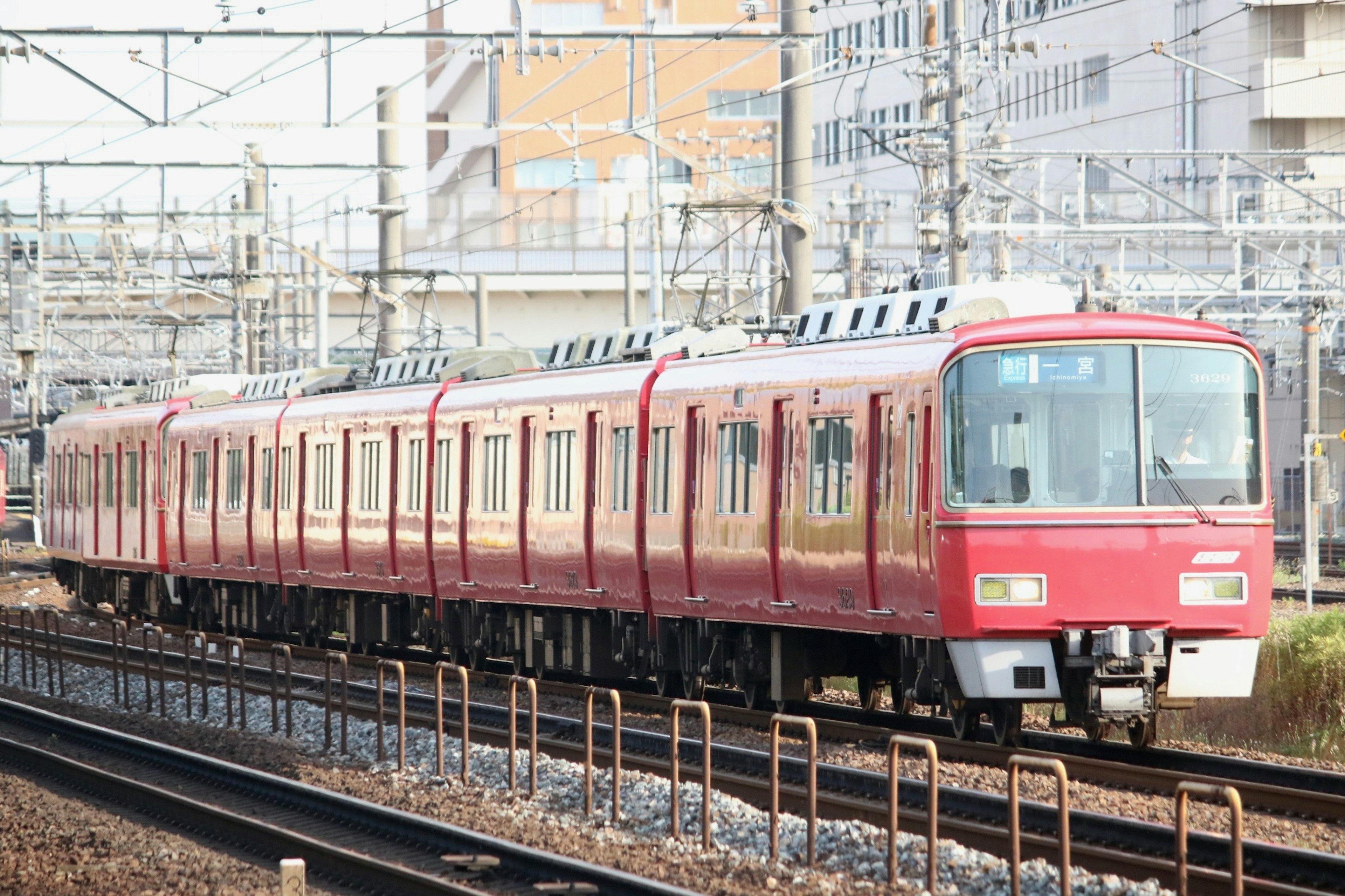 Red train running on the tracks