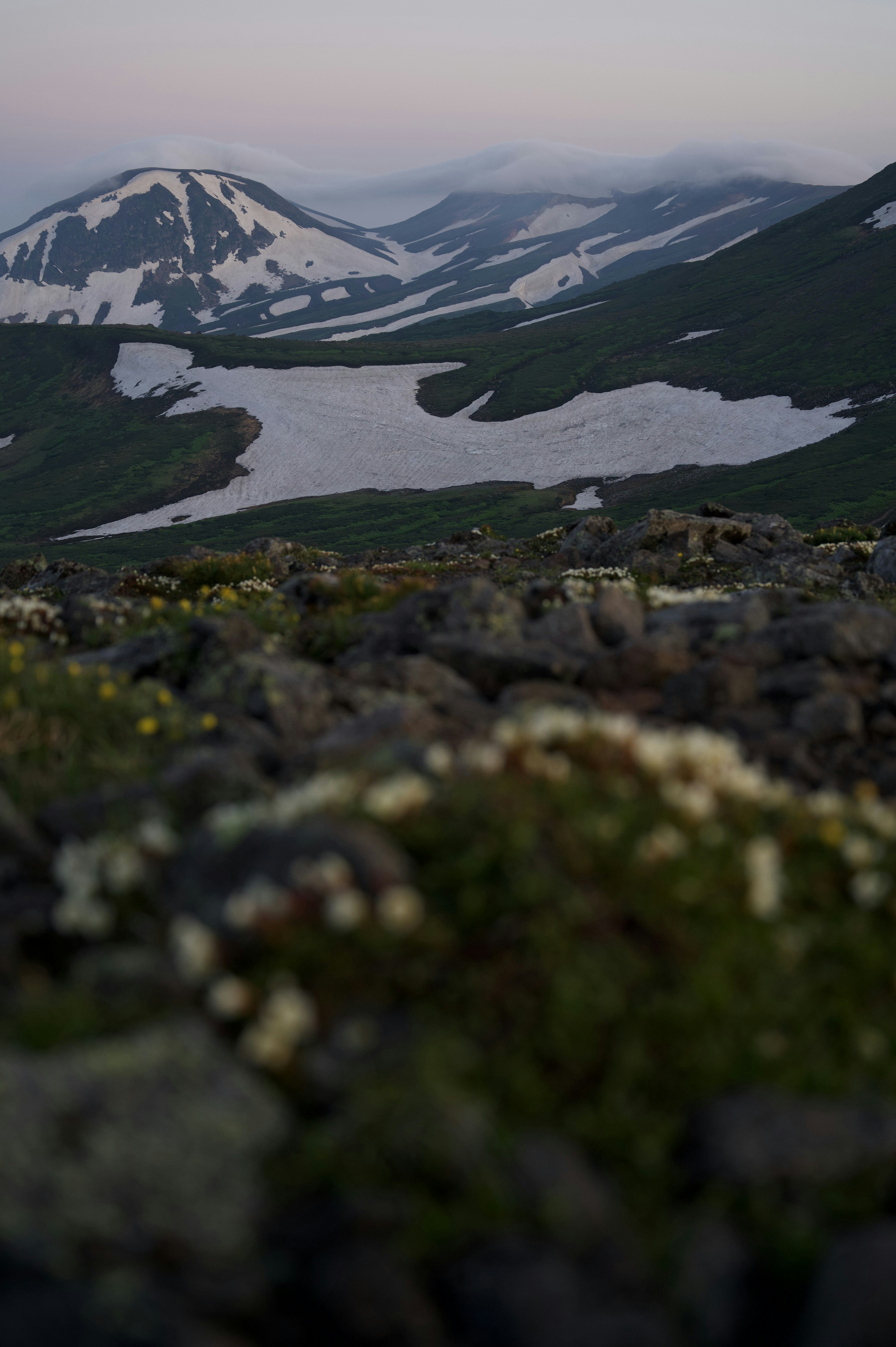 Mountain landscape with snow and a tranquil lake