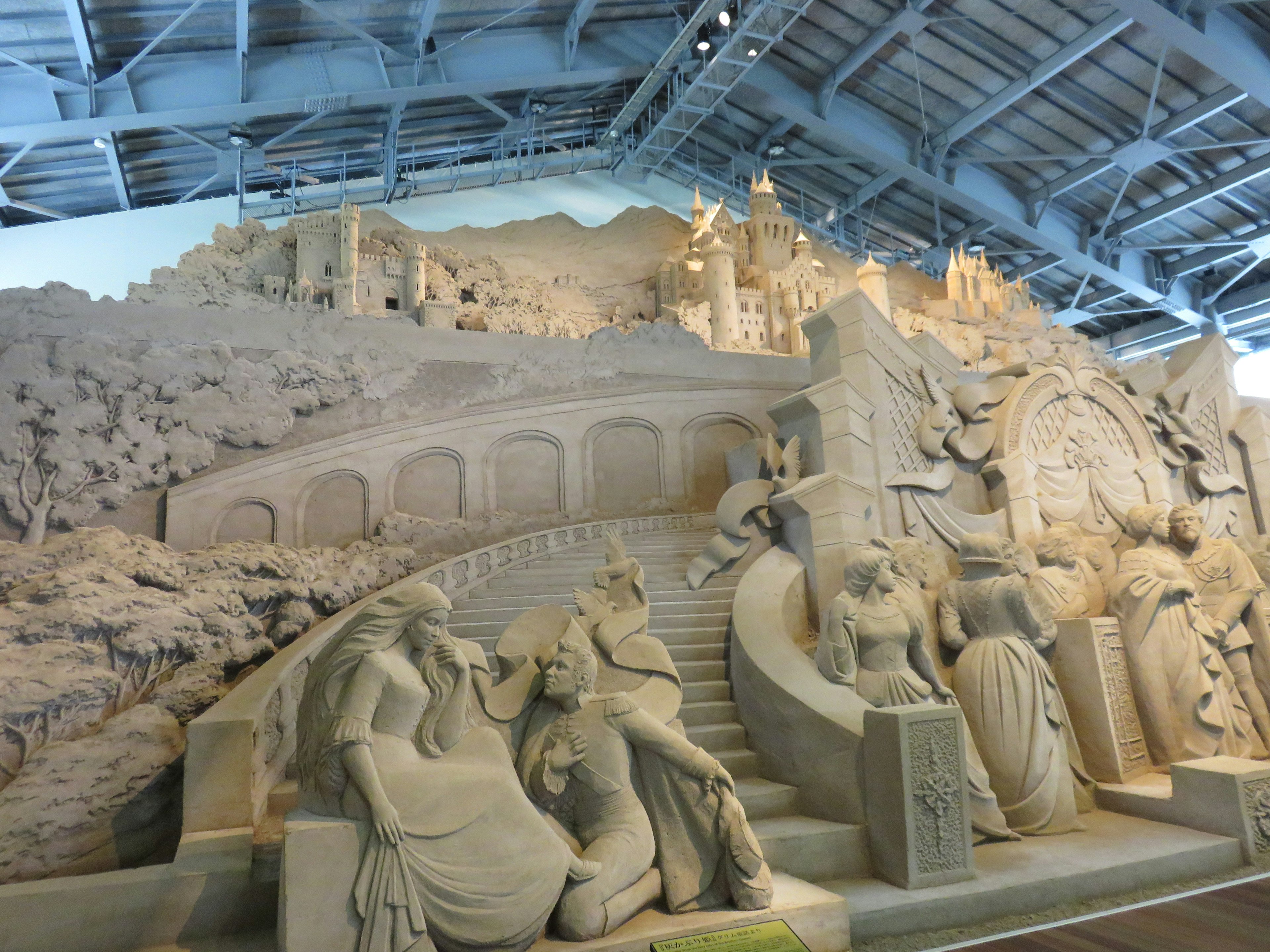 Detailed sand sculpture displayed in an indoor setting