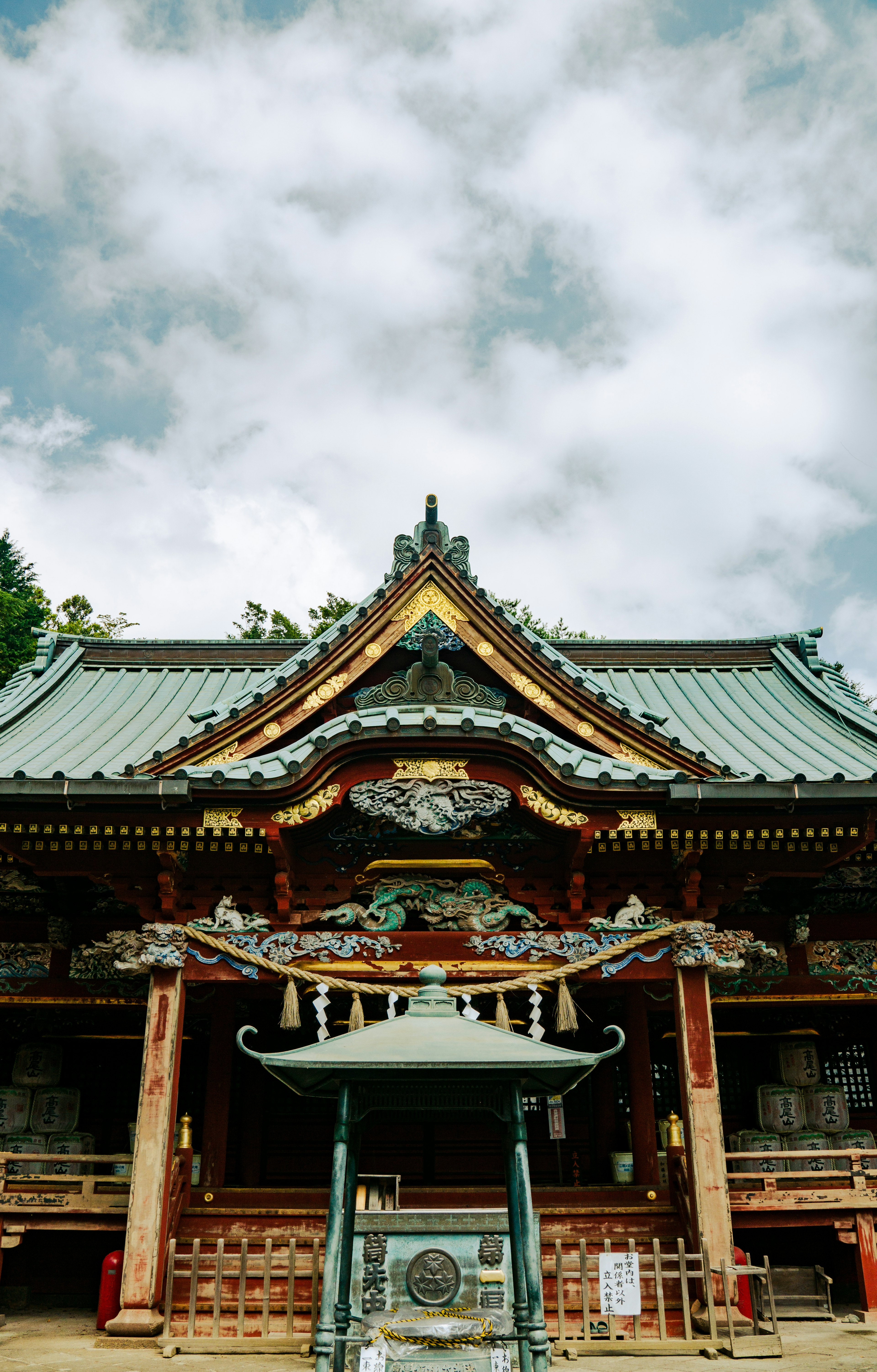 A beautiful shrine building standing under a blue sky