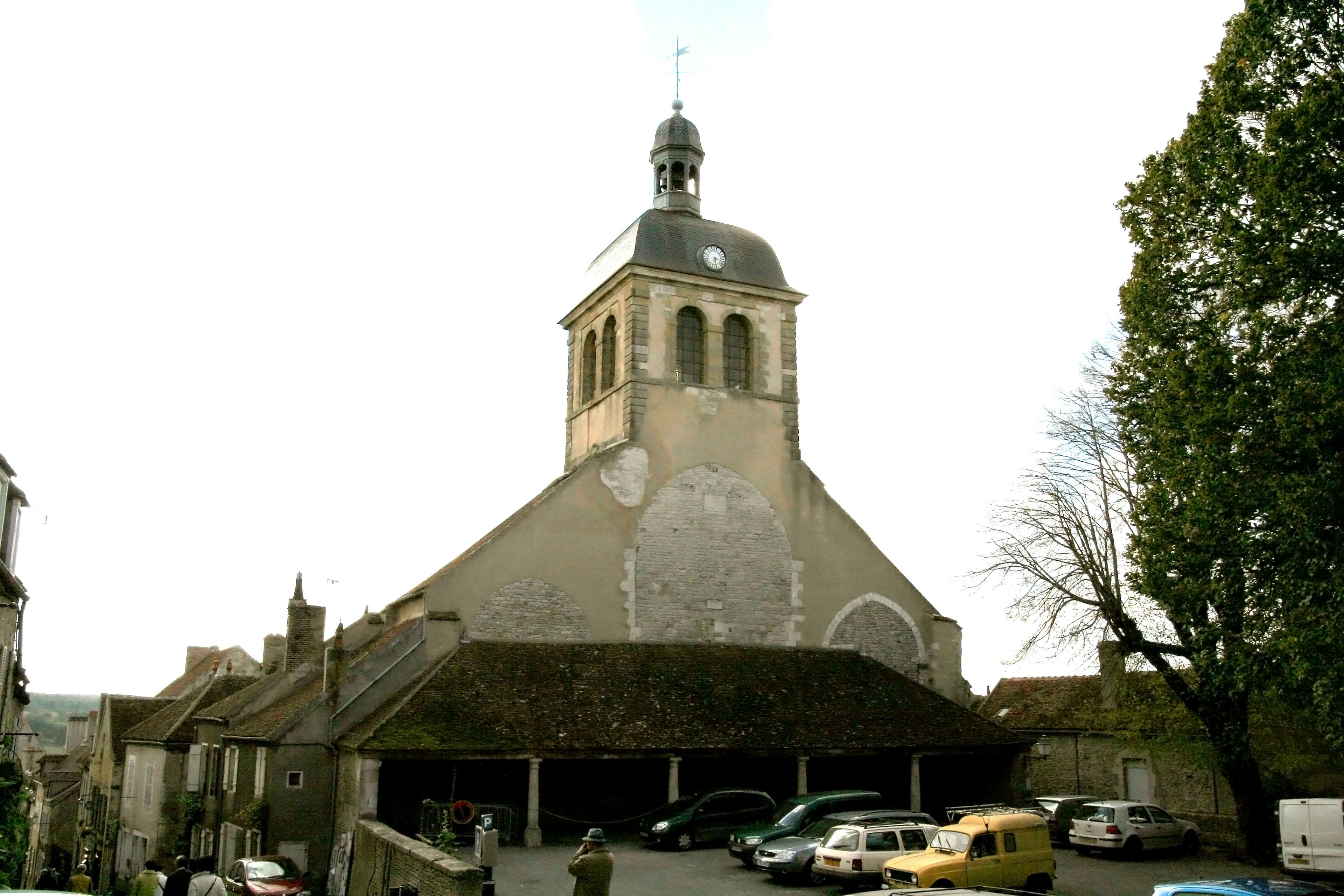 View of an old church with a bell tower and surrounding buildings