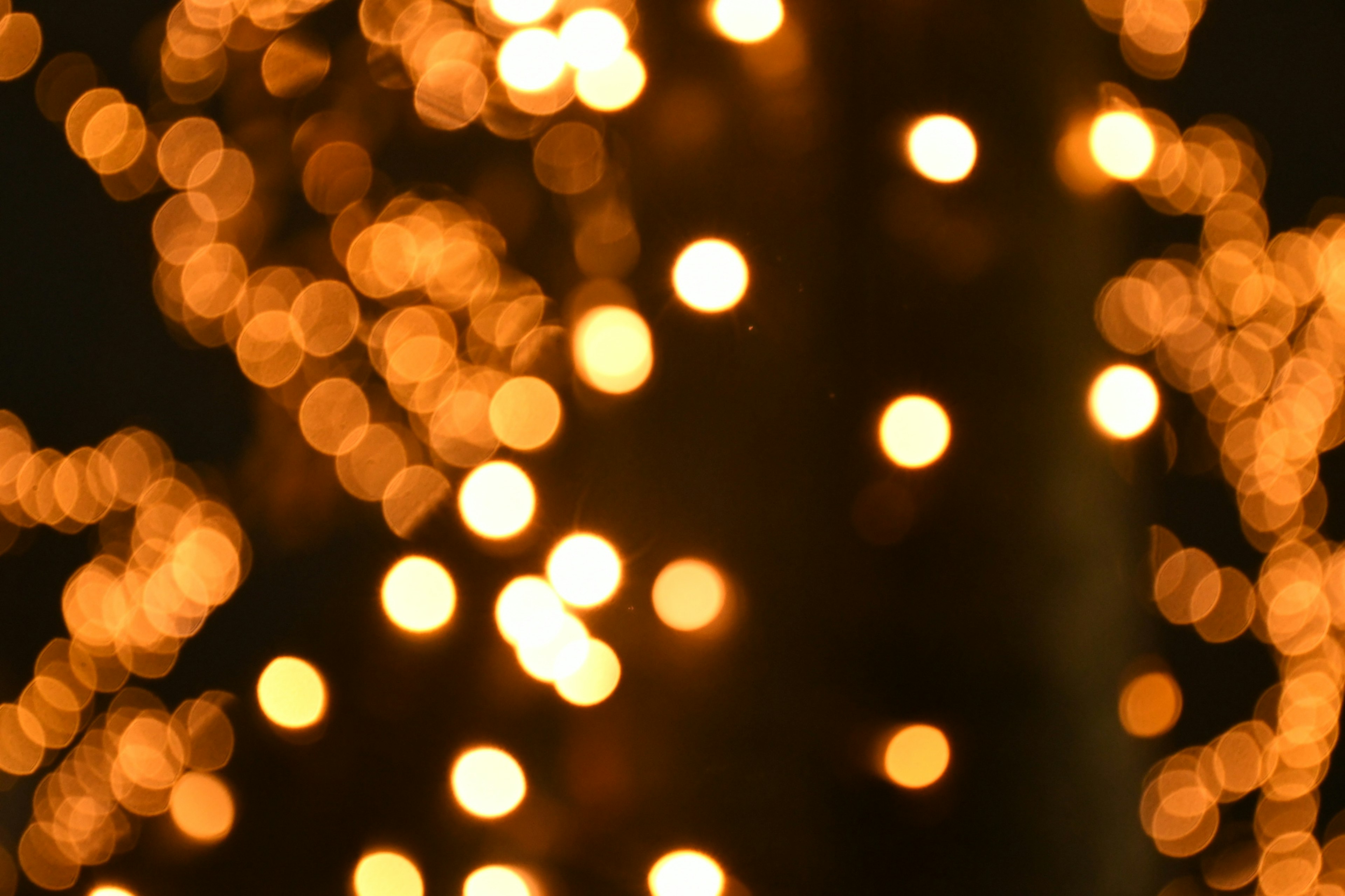 A blurred background of bright orange glowing lights