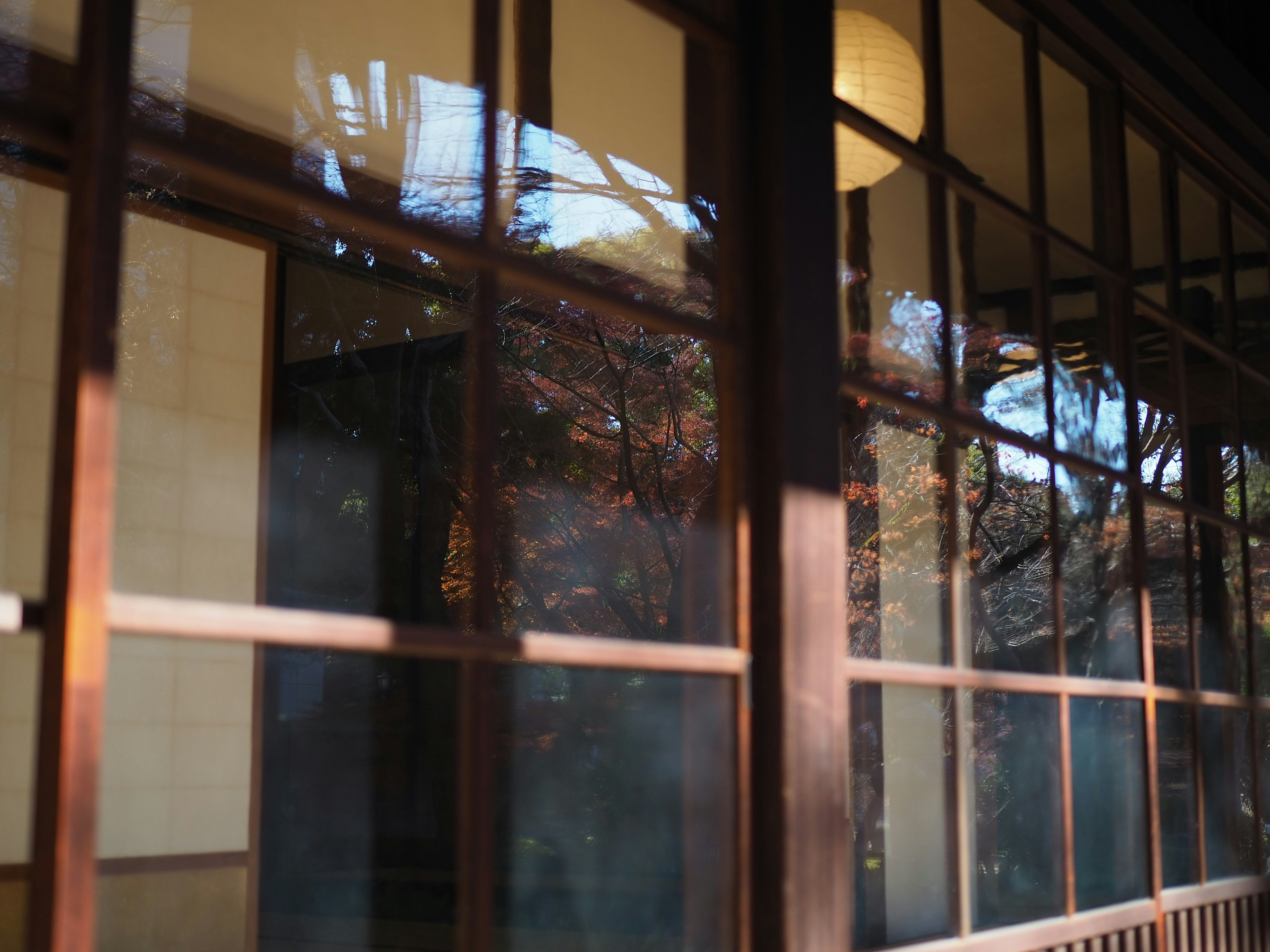 Detail of a traditional Japanese building's window and wooden frame