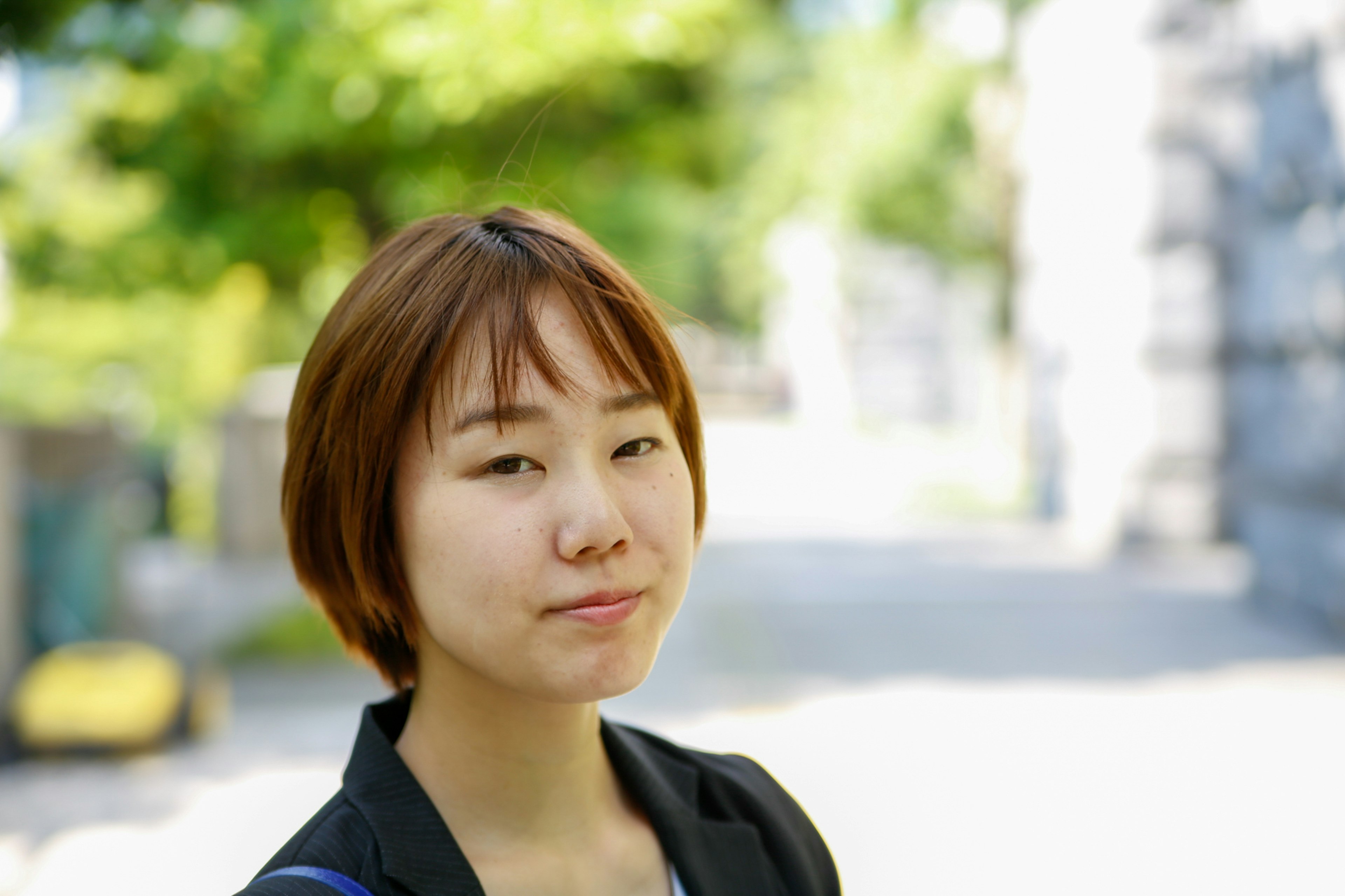 Young woman smiling in a park