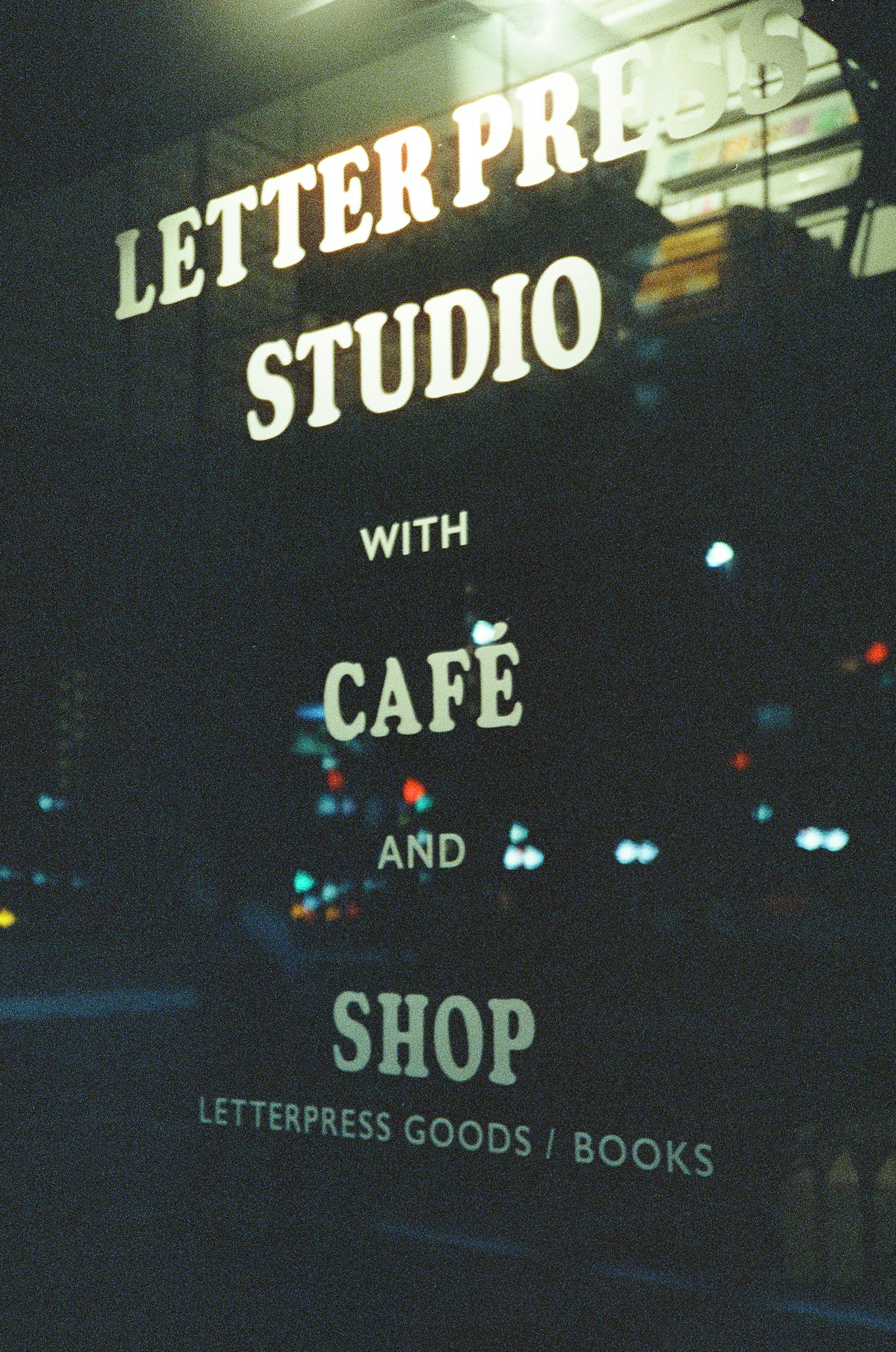 Window display of Letterpress Studio featuring café and shop