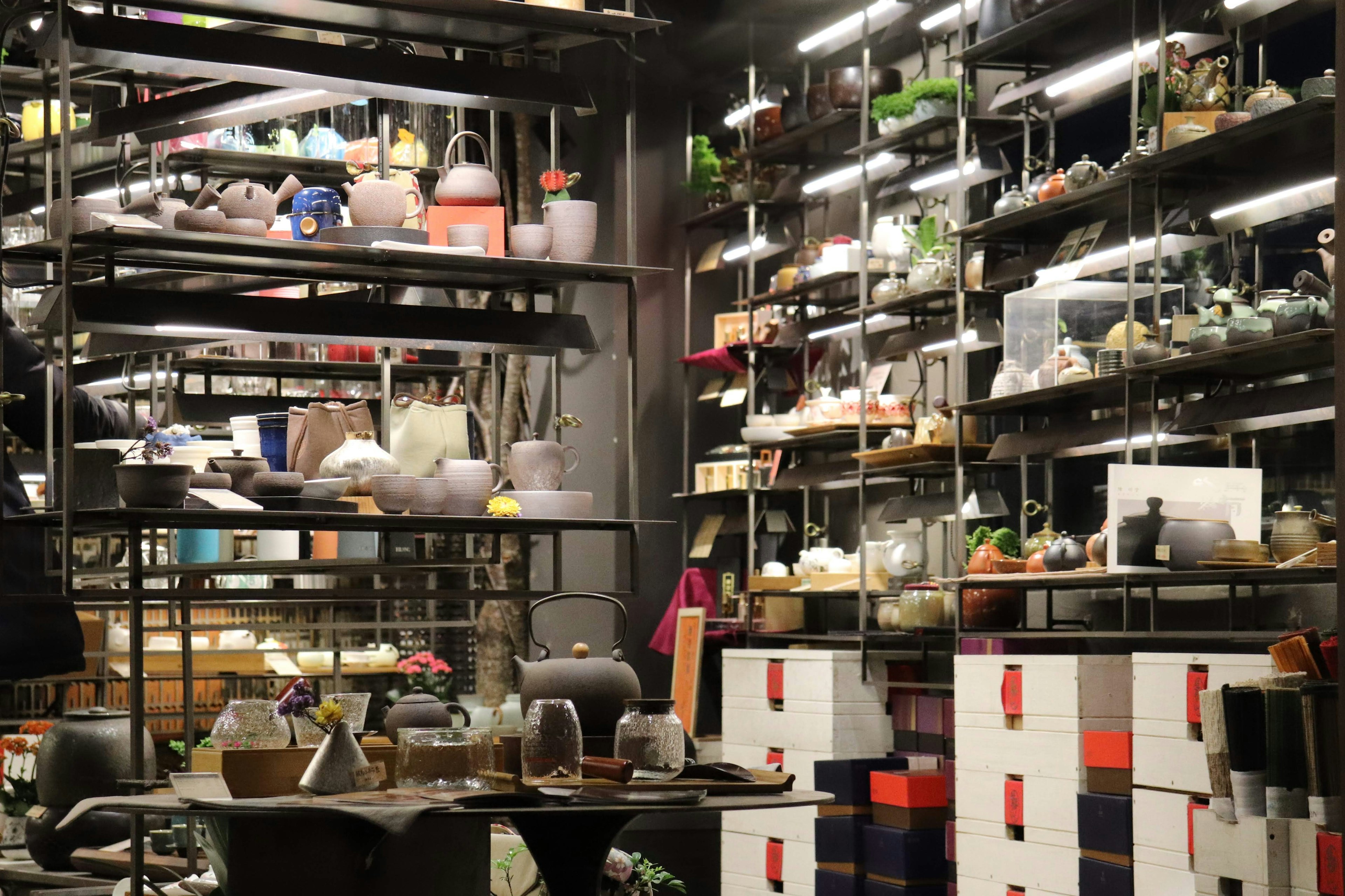 Interior of a modern home goods store displaying various pottery and kitchenware