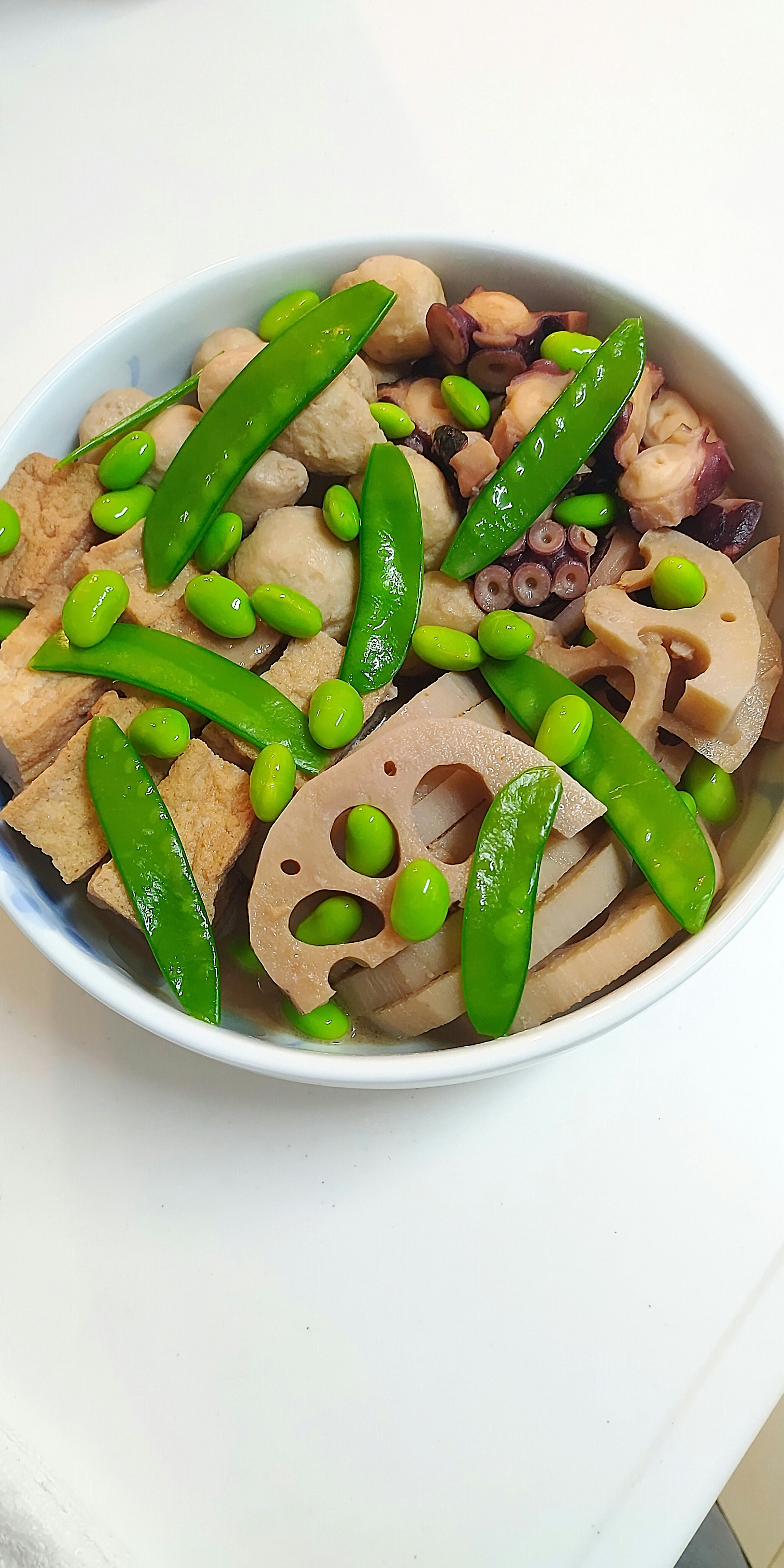 Japanese-style simmered dish with green snap peas and lotus root