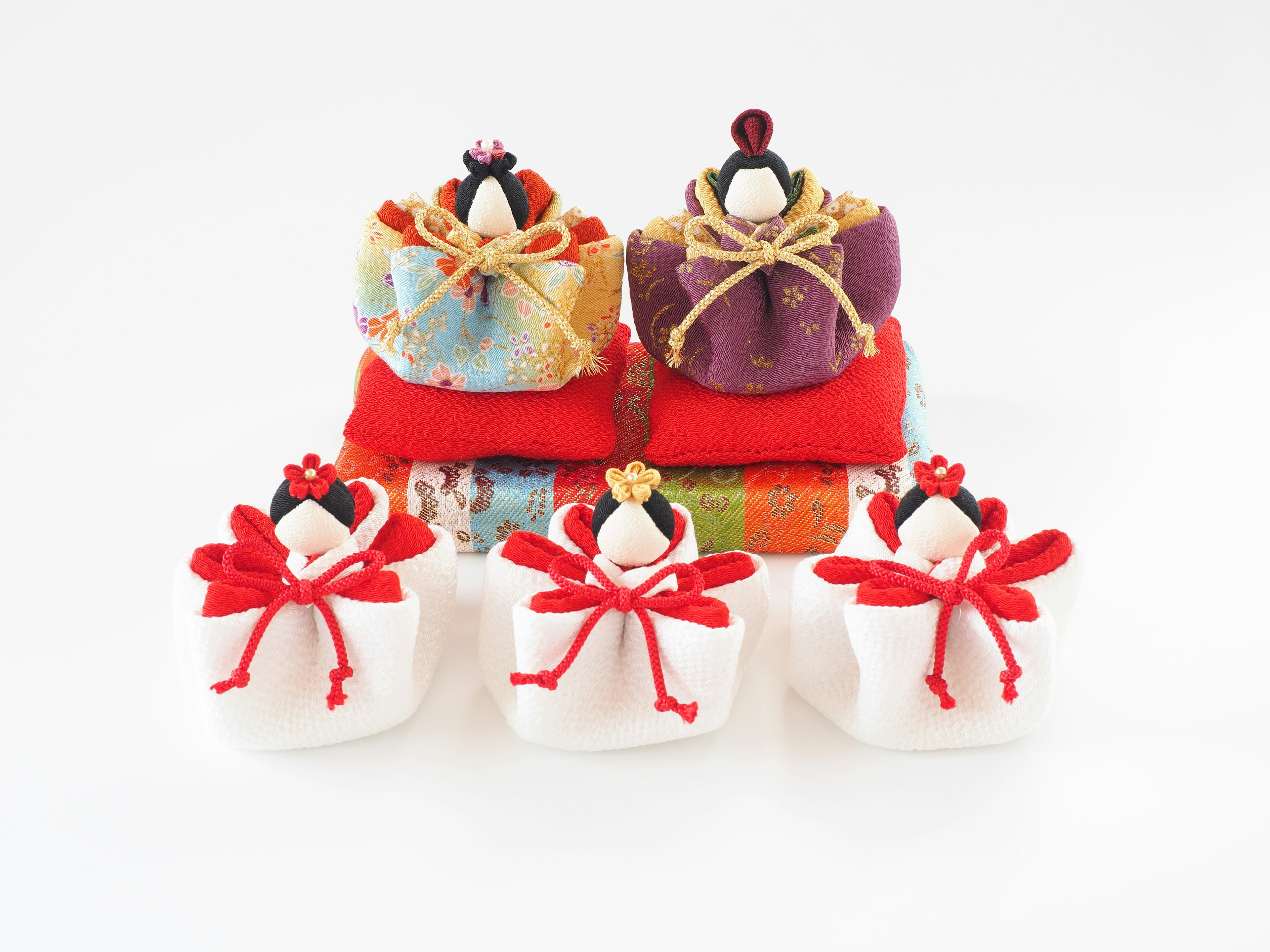 Traditional Japanese hina dolls beautifully arranged with colorful fabrics