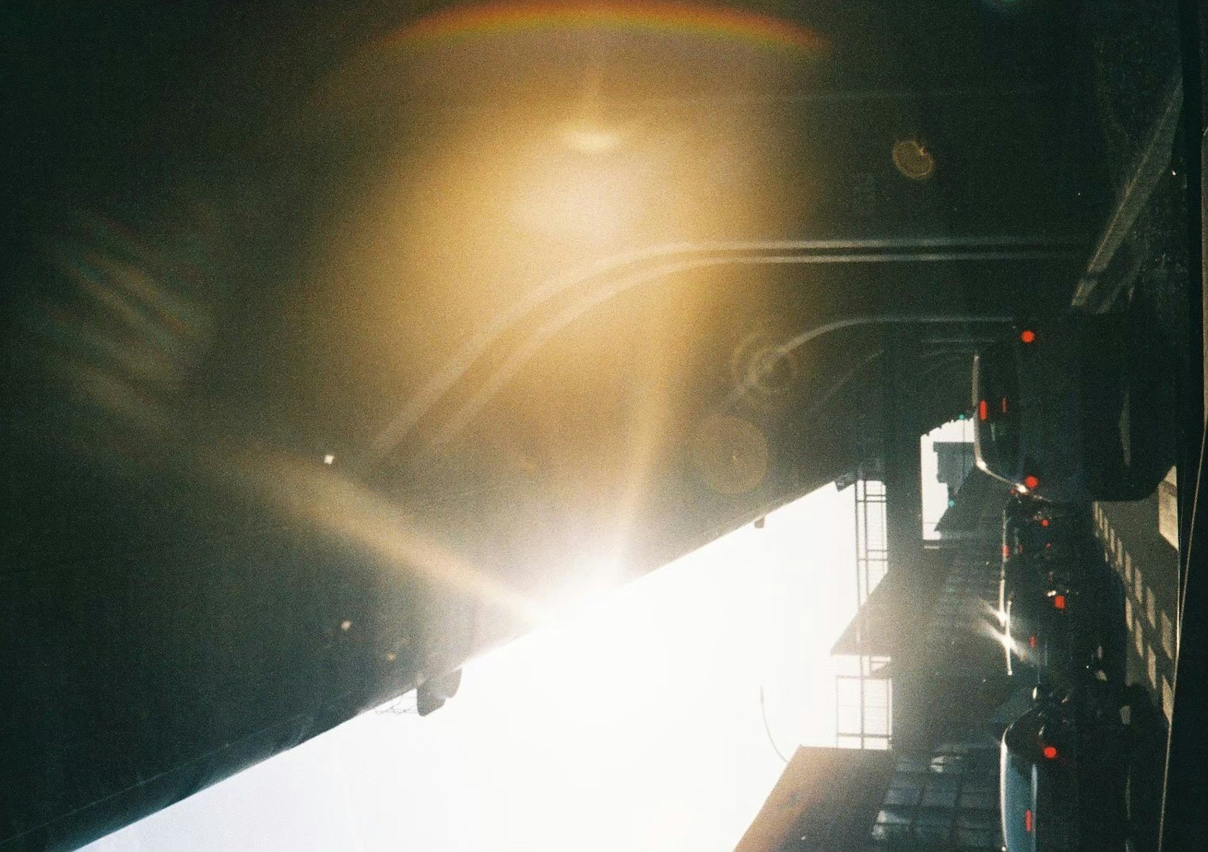 A cityscape featuring sunlight streaming through buildings