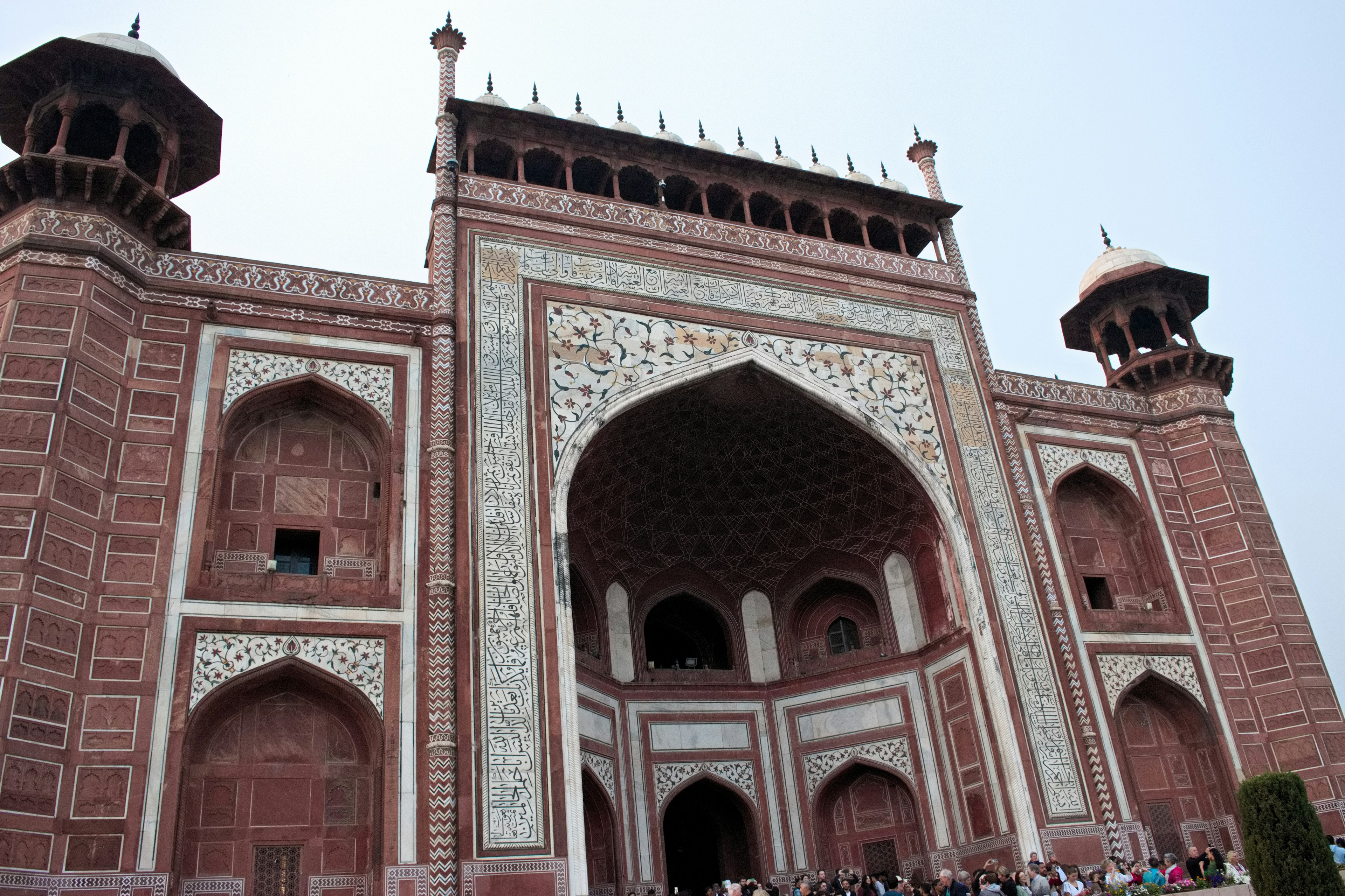 Grand entrance of the Taj Mahal with intricate designs