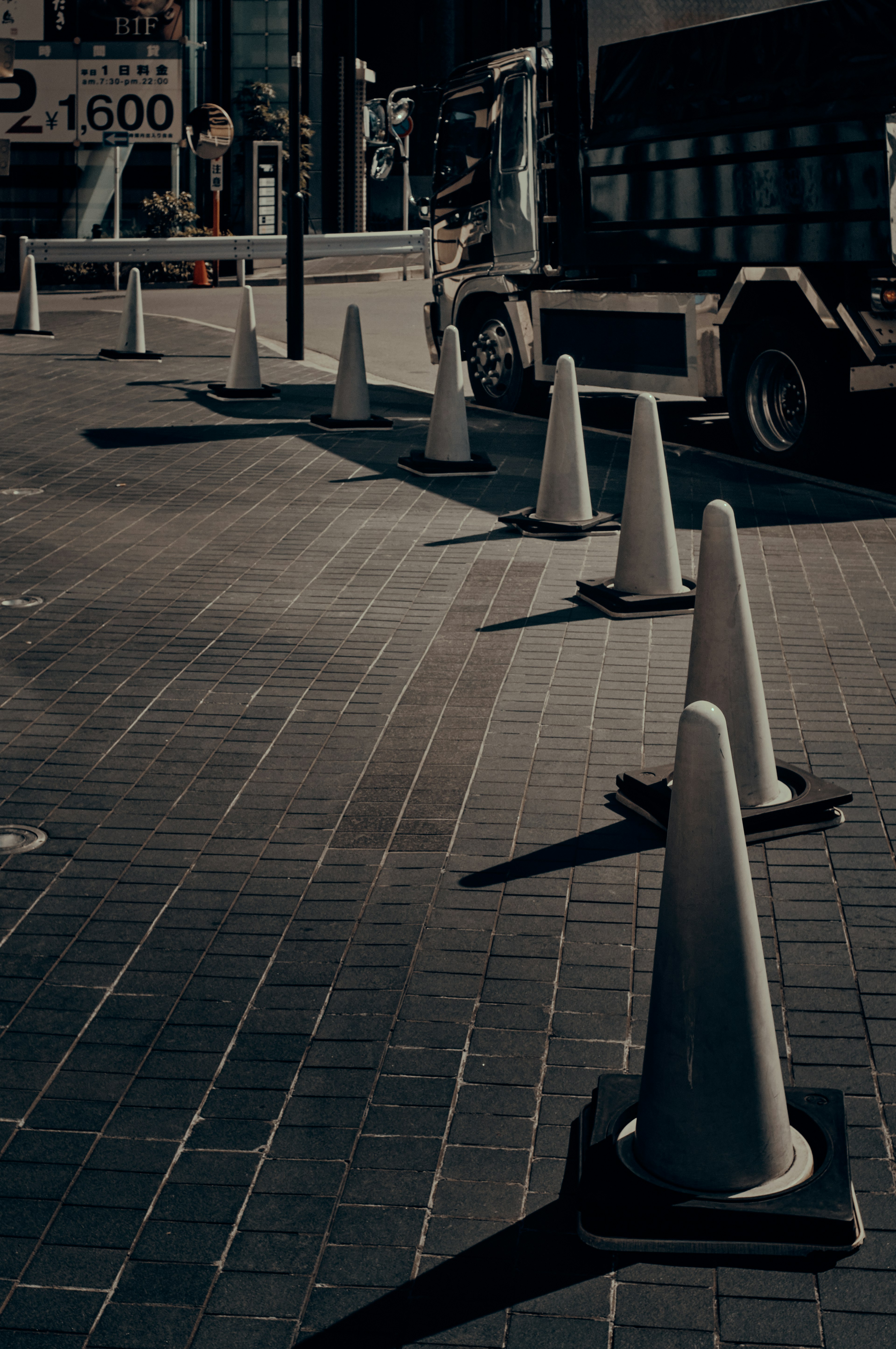 Traffic cones lined up on a paved street