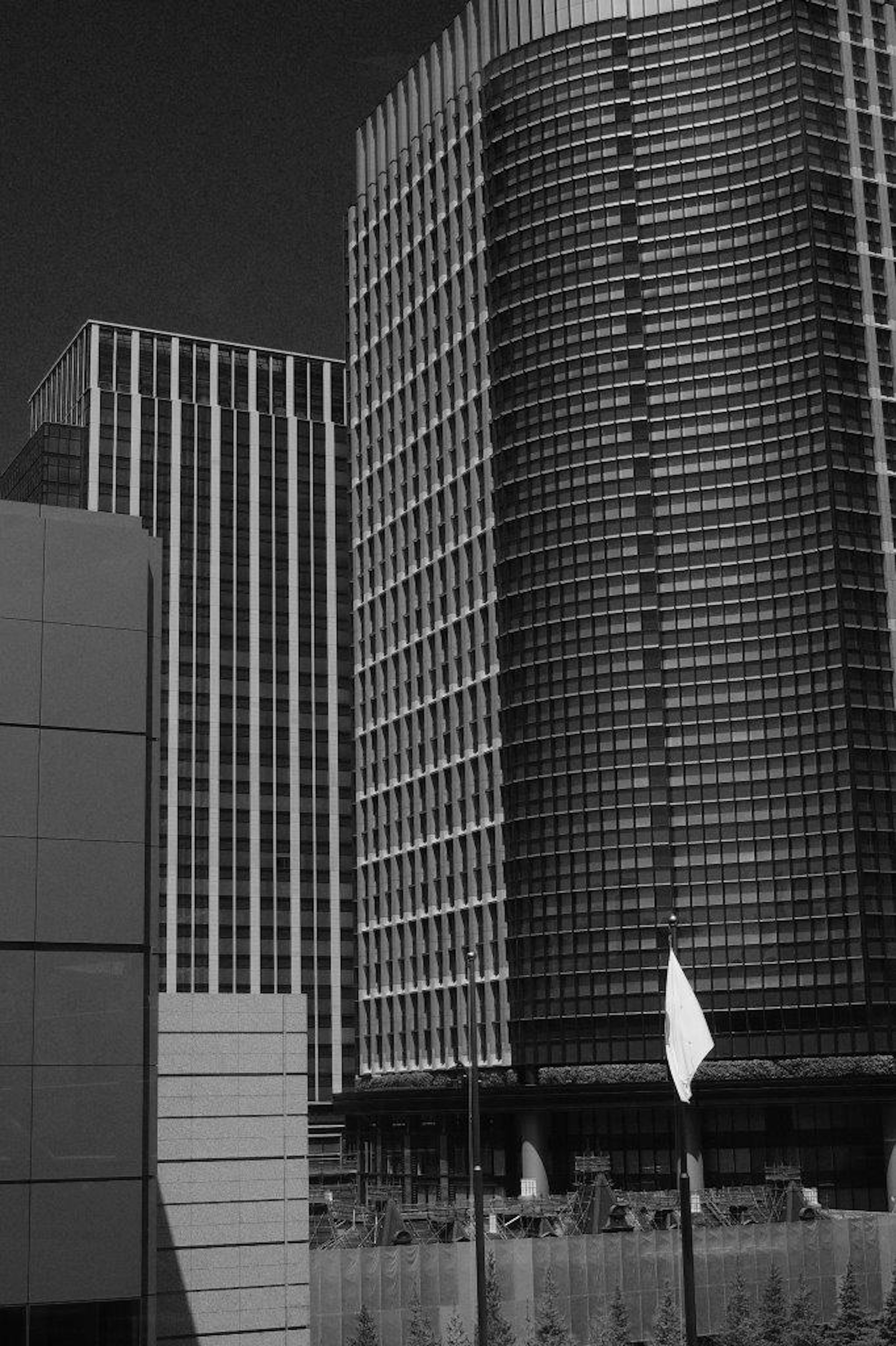 Black and white photograph of tall buildings with modern architecture