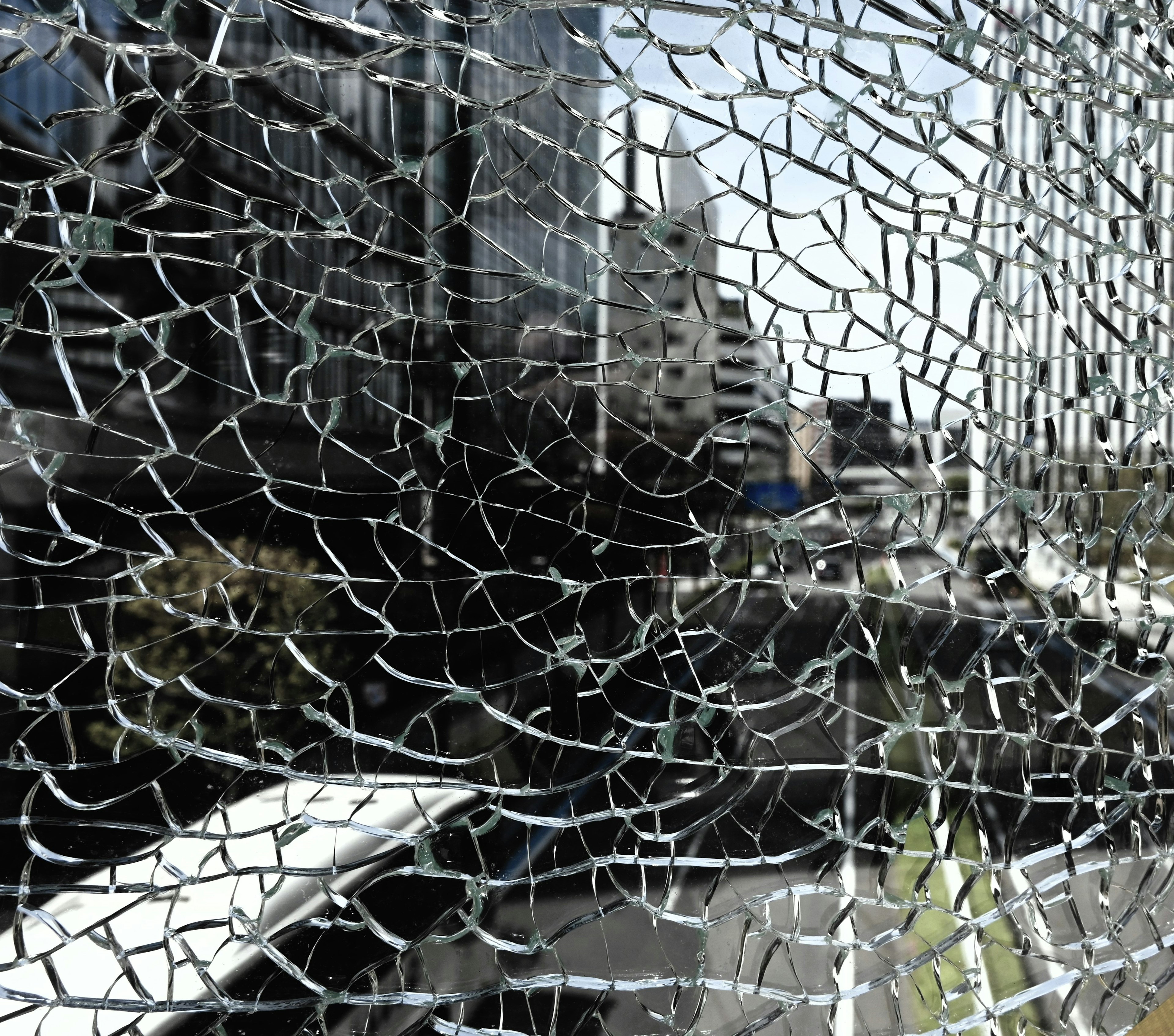 Cityscape viewed through broken glass