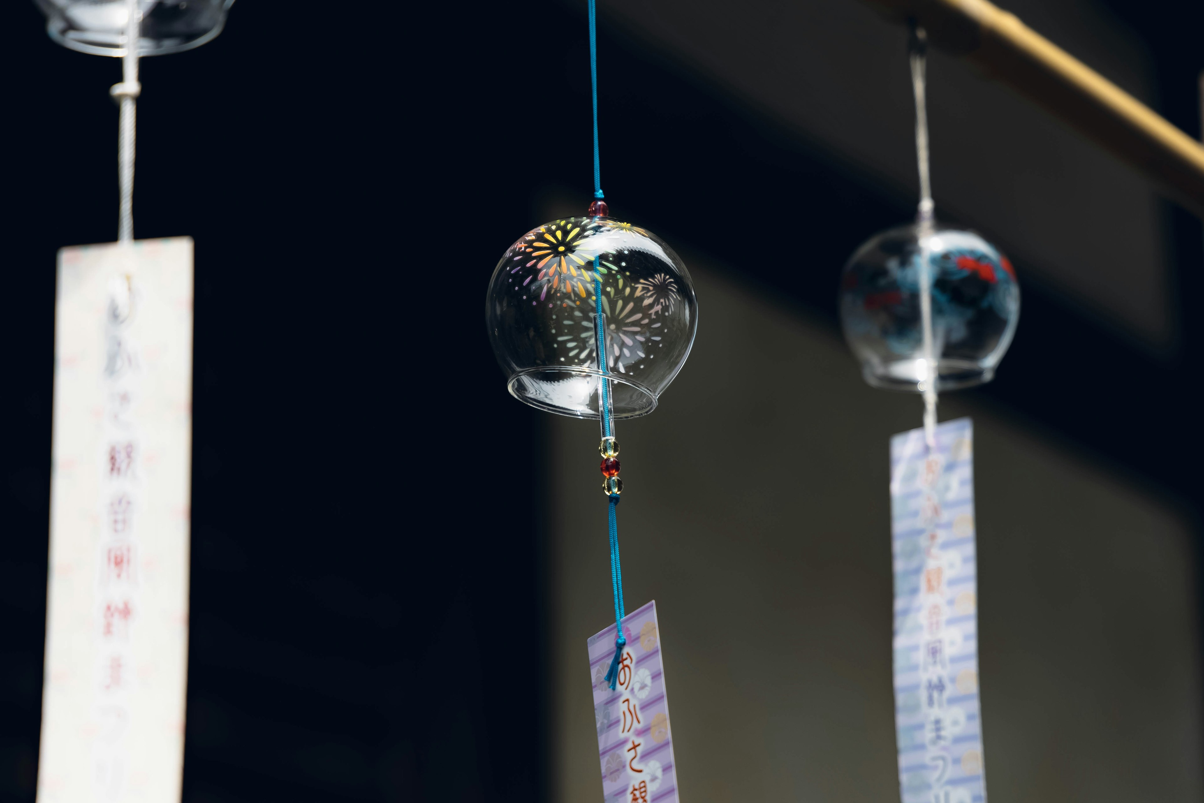 Traditional Japanese wind chimes hanging with colorful glass and paper strips