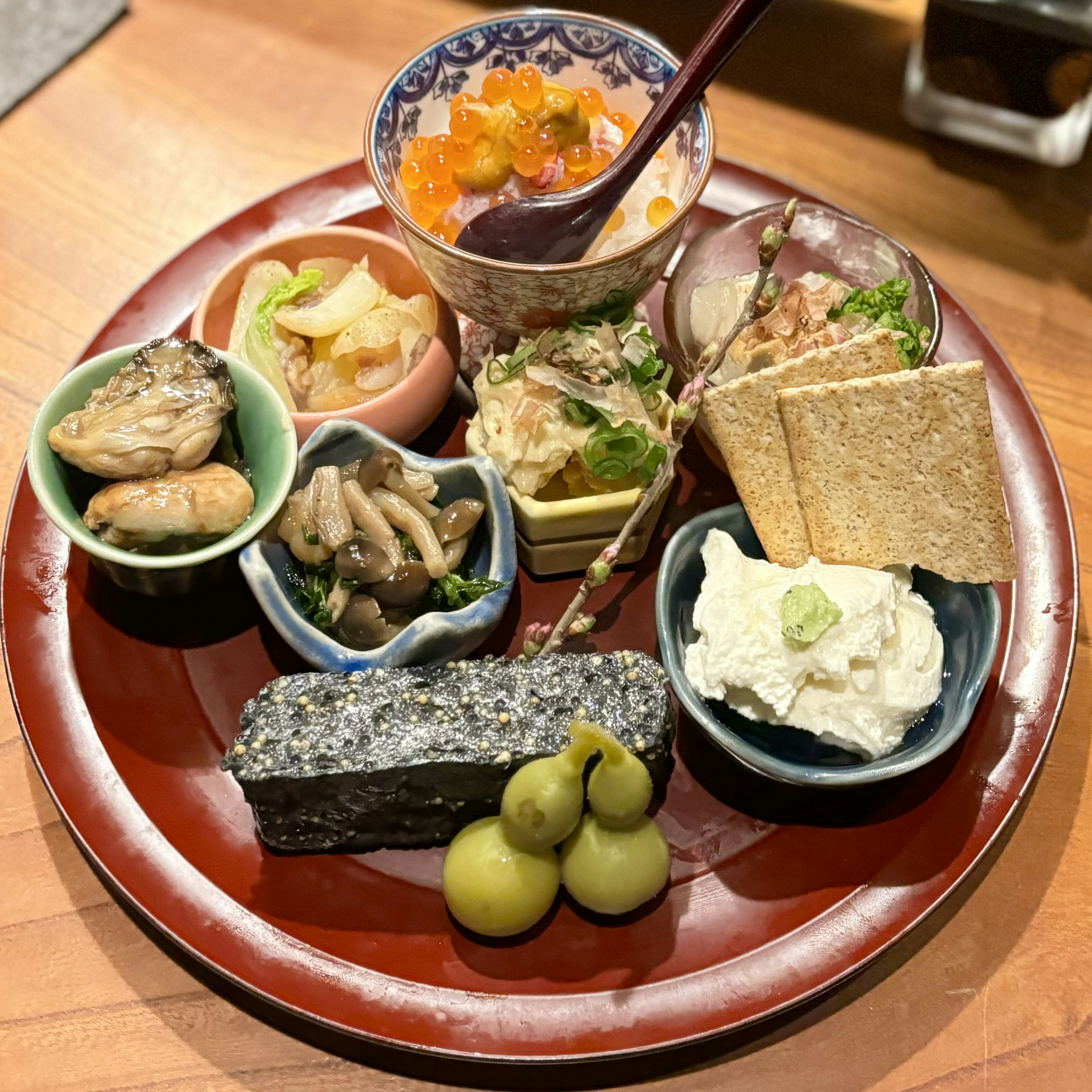 A beautifully arranged plate of colorful Japanese dishes