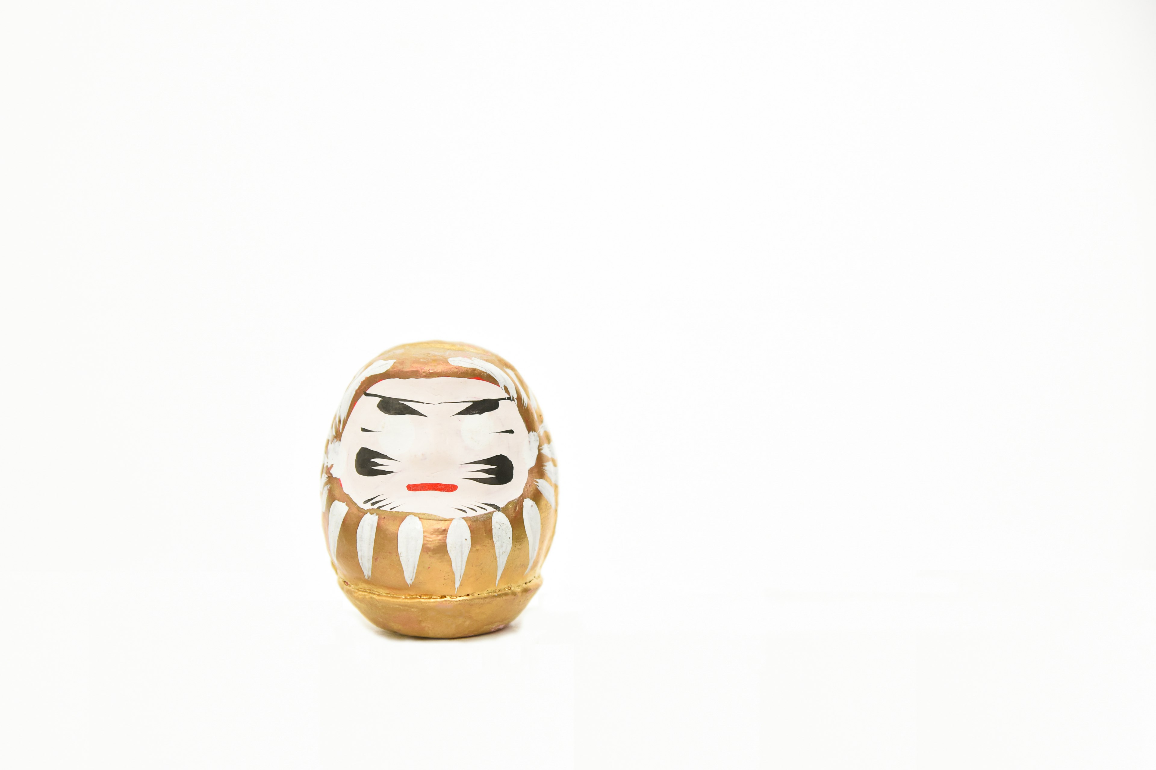 Daruma doll placed on a white background