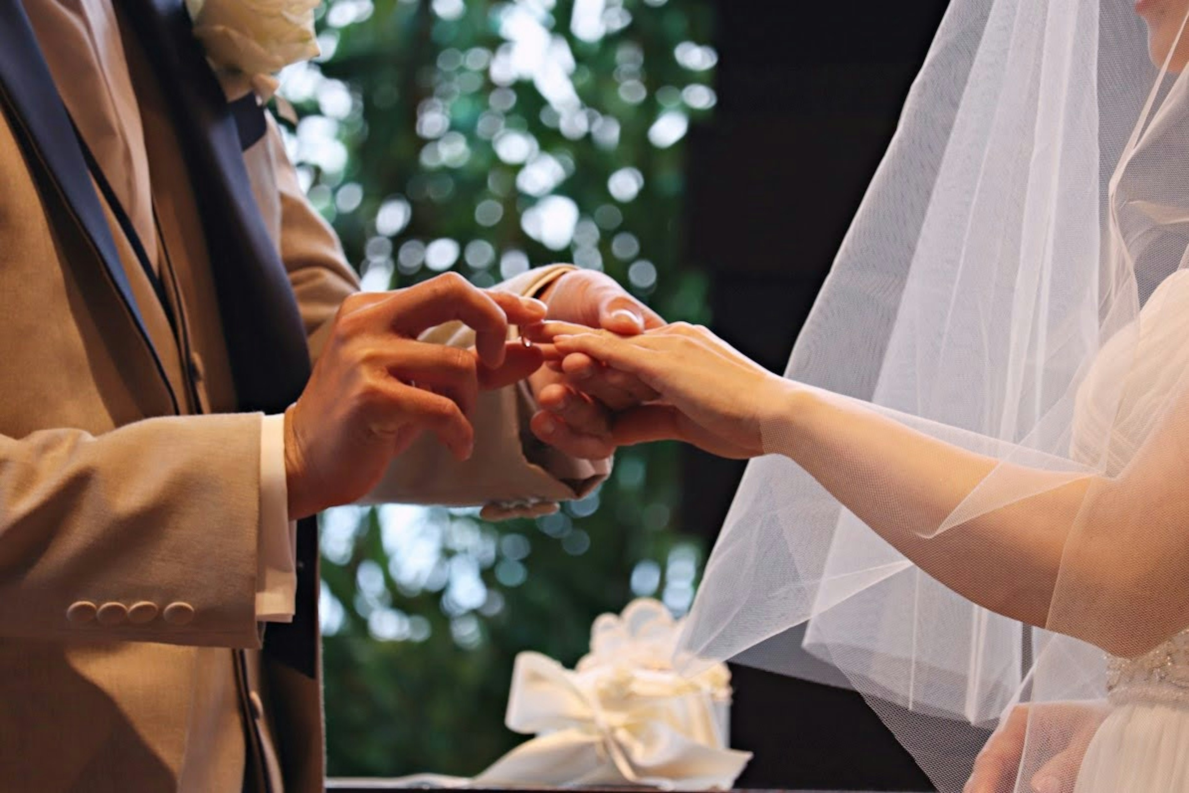 Couple exchanging rings during wedding ceremony