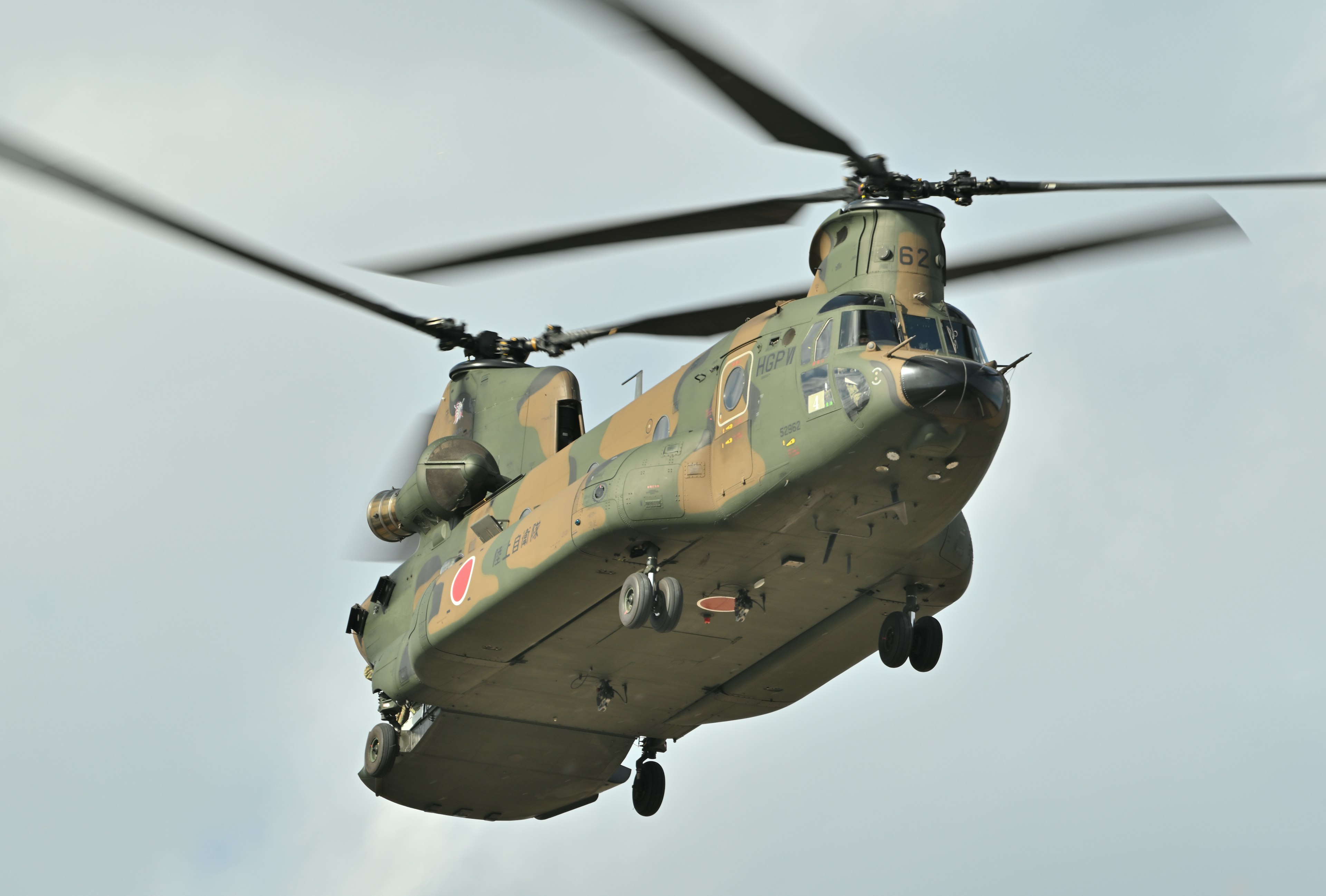 Chinook helicopter flying against a cloudy sky