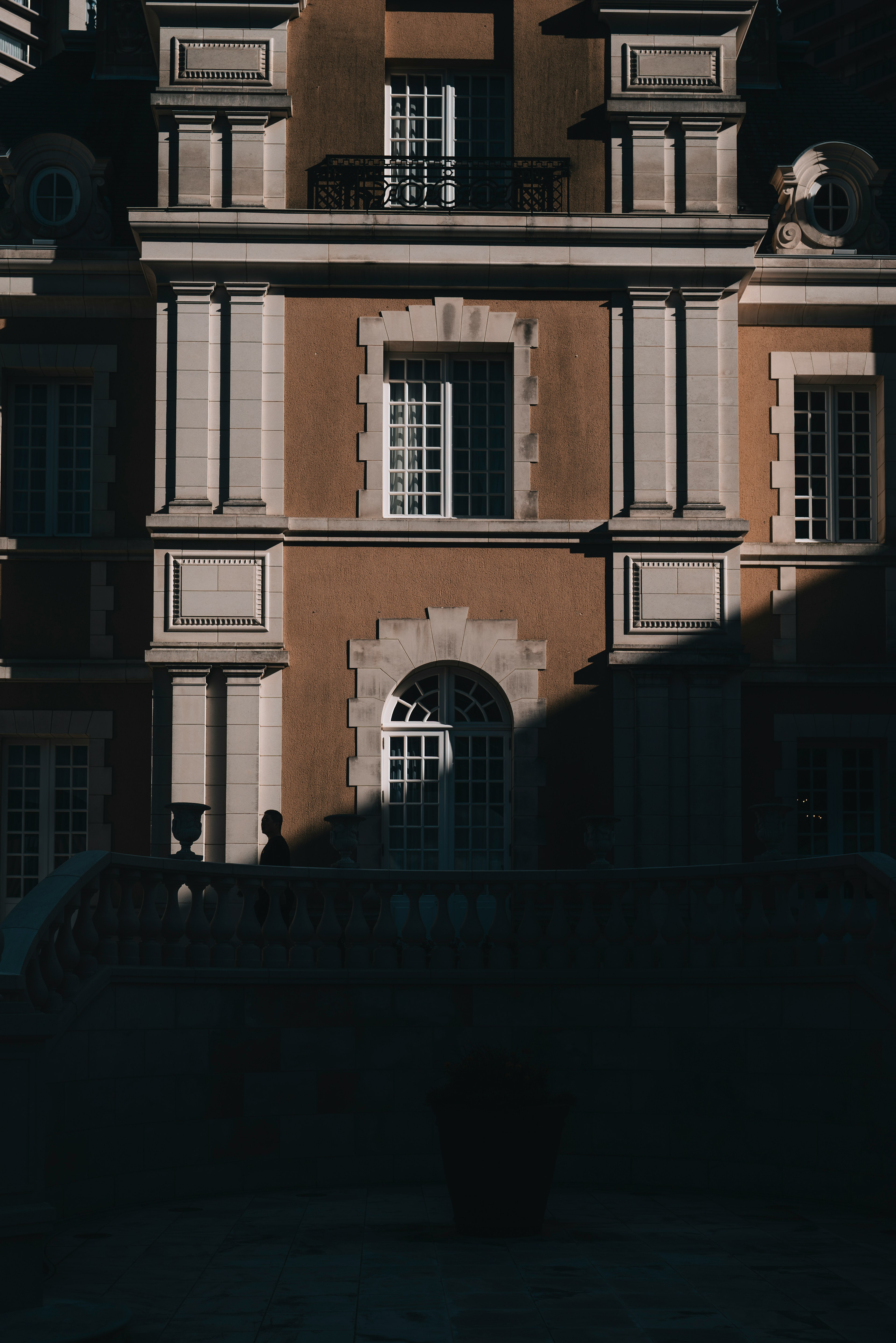 Classic building facade with shadows and windows